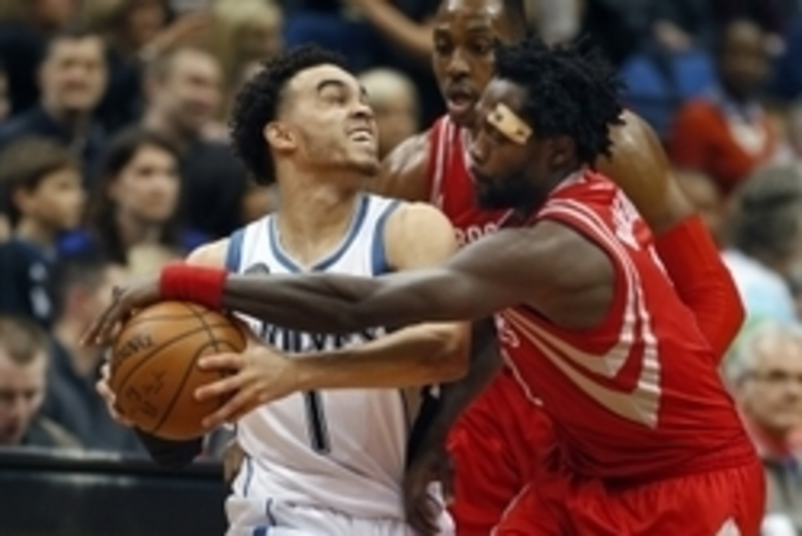 Apr 11, 2016; Minneapolis, MN, USA; Houston Rockets guard Patrick Beverley (2) tries to wrestle the ball away from Minnesota Timberwolves guard Tyus Jones (1) in the second quarter at Target Center. Mandatory Credit: Bruce Kluckhohn-USA TODAY Sports