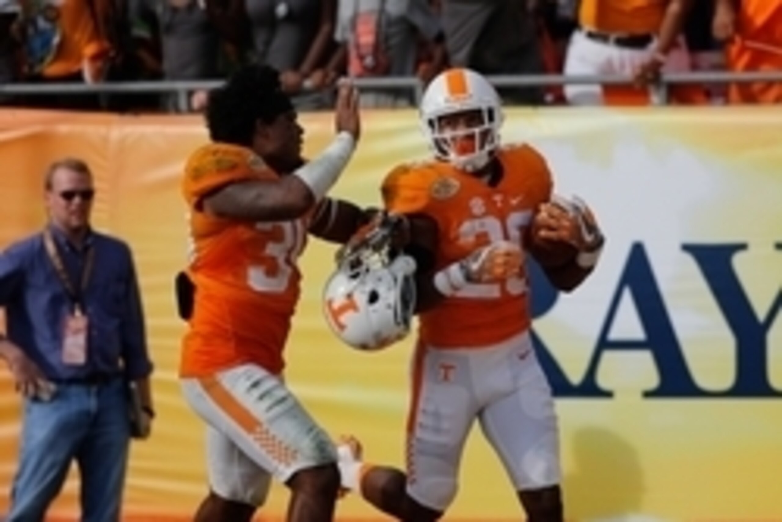 Jan 1, 2016; Tampa, FL, USA; Tennessee Volunteers defensive back Evan Berry (29) is congratulated as he ran the ball back for 100 yard touchdown during the second half against the Northwestern Wildcats in the 2016 Outback Bowl at Raymond James Stadium. T Jan 1, 2016; Tampa, FL, USA; Tennessee Volunteers defensive back Evan Berry (29) is congratulated as he ran the ball back for 100 yard touchdown during the second half against the Northwestern Wildcats in the 2016 Outback Bowl at Raymond James Stadium. T