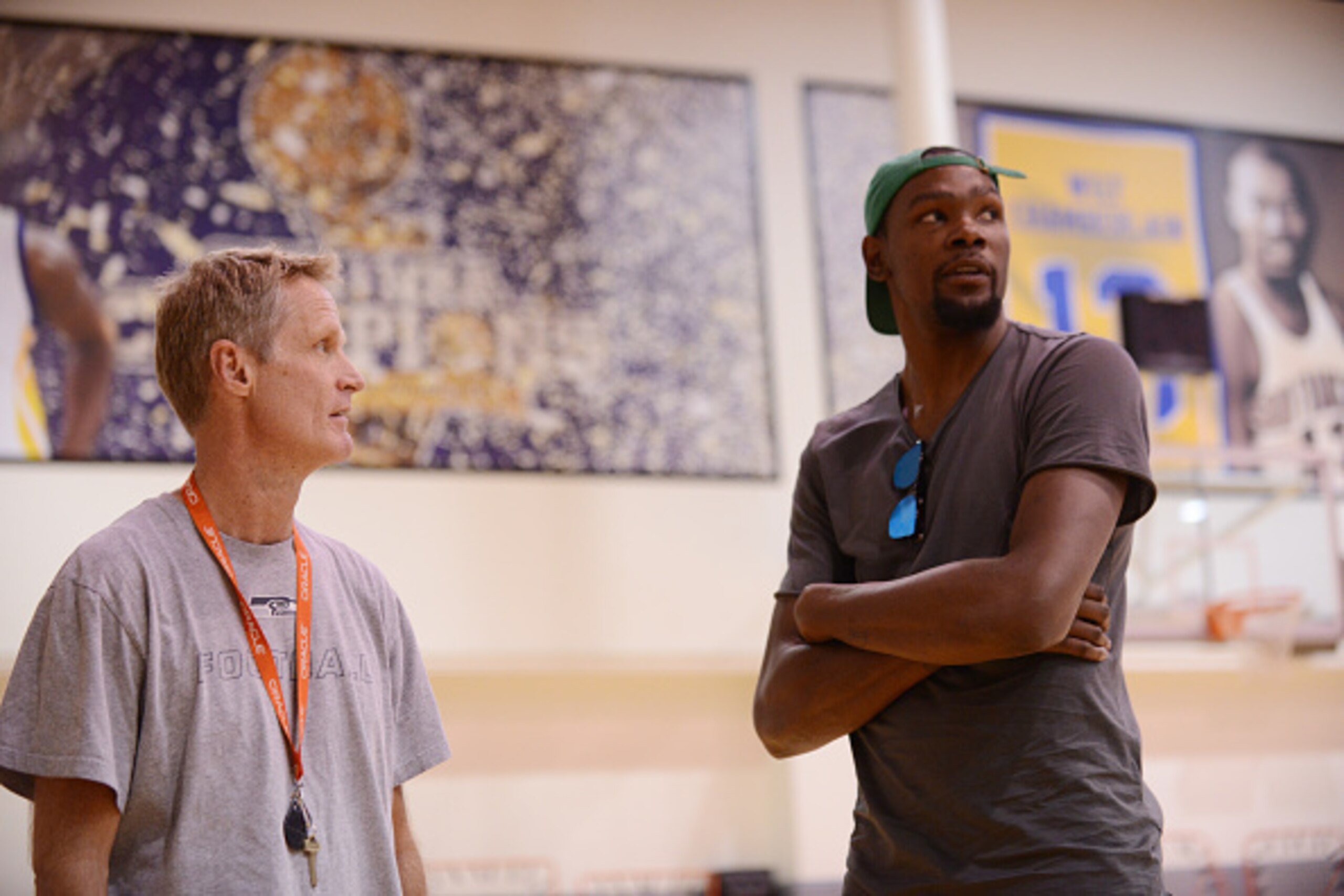 OAKLAND, CA - JULY 7:  Head coach Steve Kerr of the Golden State Warriors and Kevin Durant talk before the press conference to introduce Kevin Durant on July 7, 2016 in Oakland, California. NOTE TO USER: User expressly acknowledges and agrees that, by dow