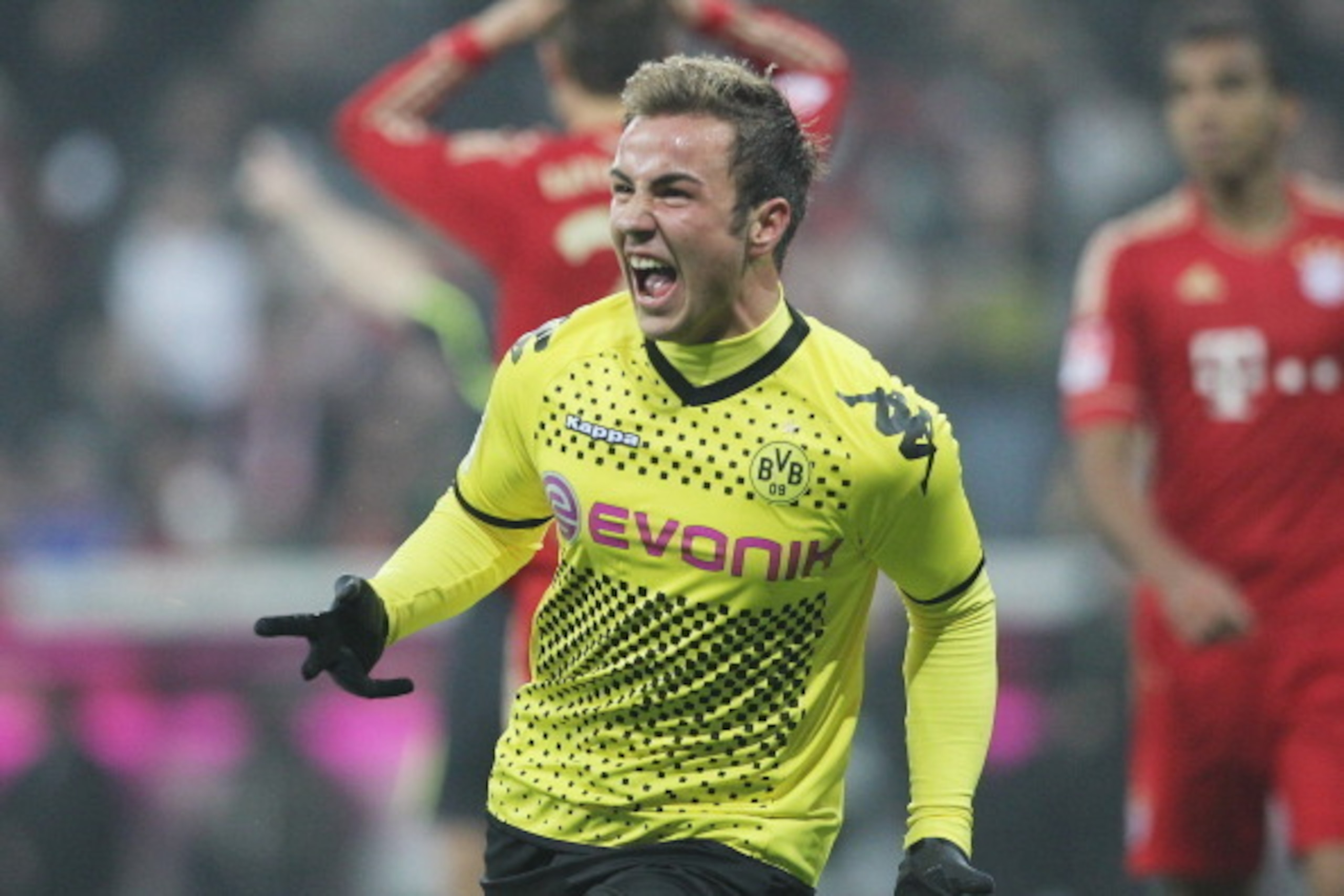 MUNICH, GERMANY - NOVEMBER 19:  Mario Goetze of Dortmund celebrates scoring the opening goal during the Bundesliga match between FC Bayern Muenchen and Borussia Dortmund at Allianz Arena on November 19, 2011 in Munich, Germany.  (Photo by Boris Streubel/G