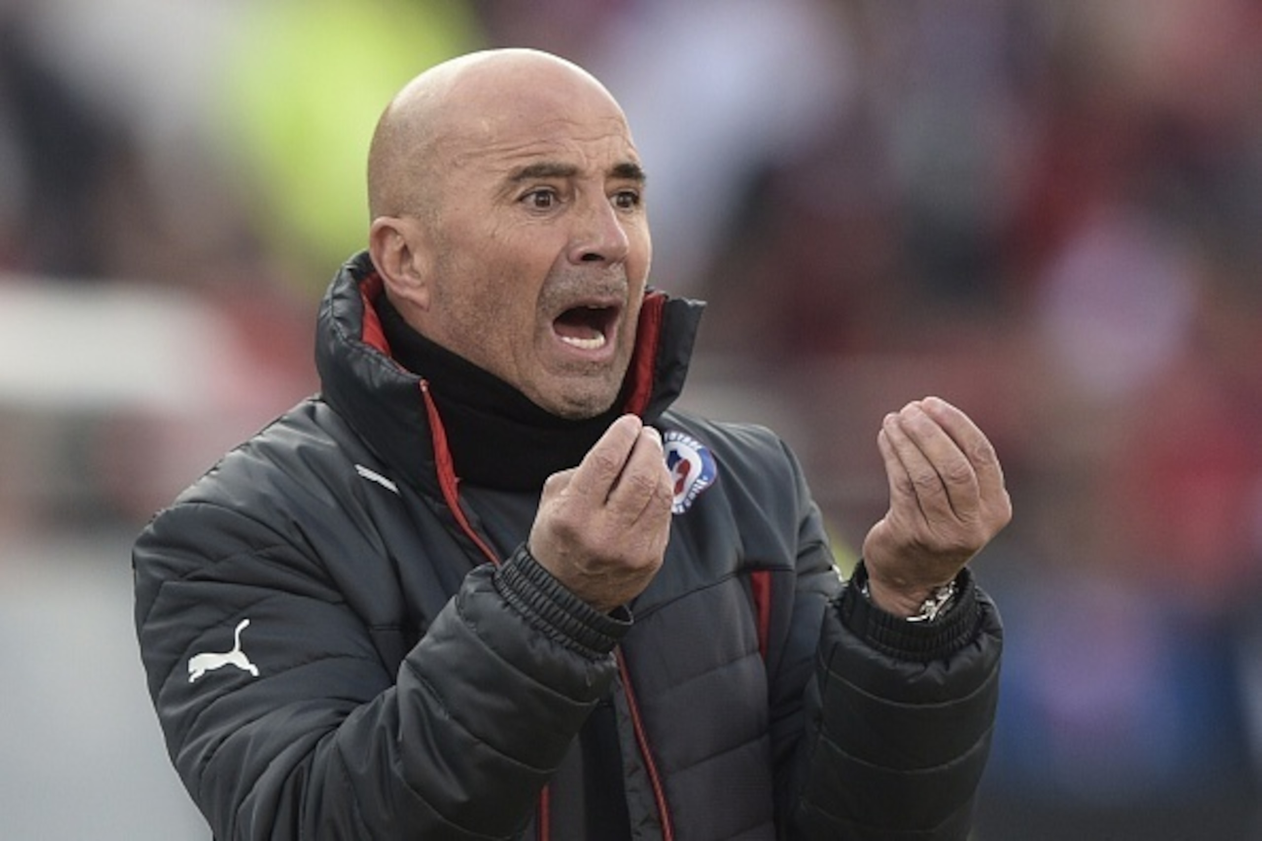 Chile's coach Jorge Sampaoli gestures during their 2015 Copa America football championship final, in Santiago, Chile, on July 4, 2015.      AFP PHOTO / JUAN MABROMATA        (Photo credit should read JUAN MABROMATA/AFP/Getty Images)