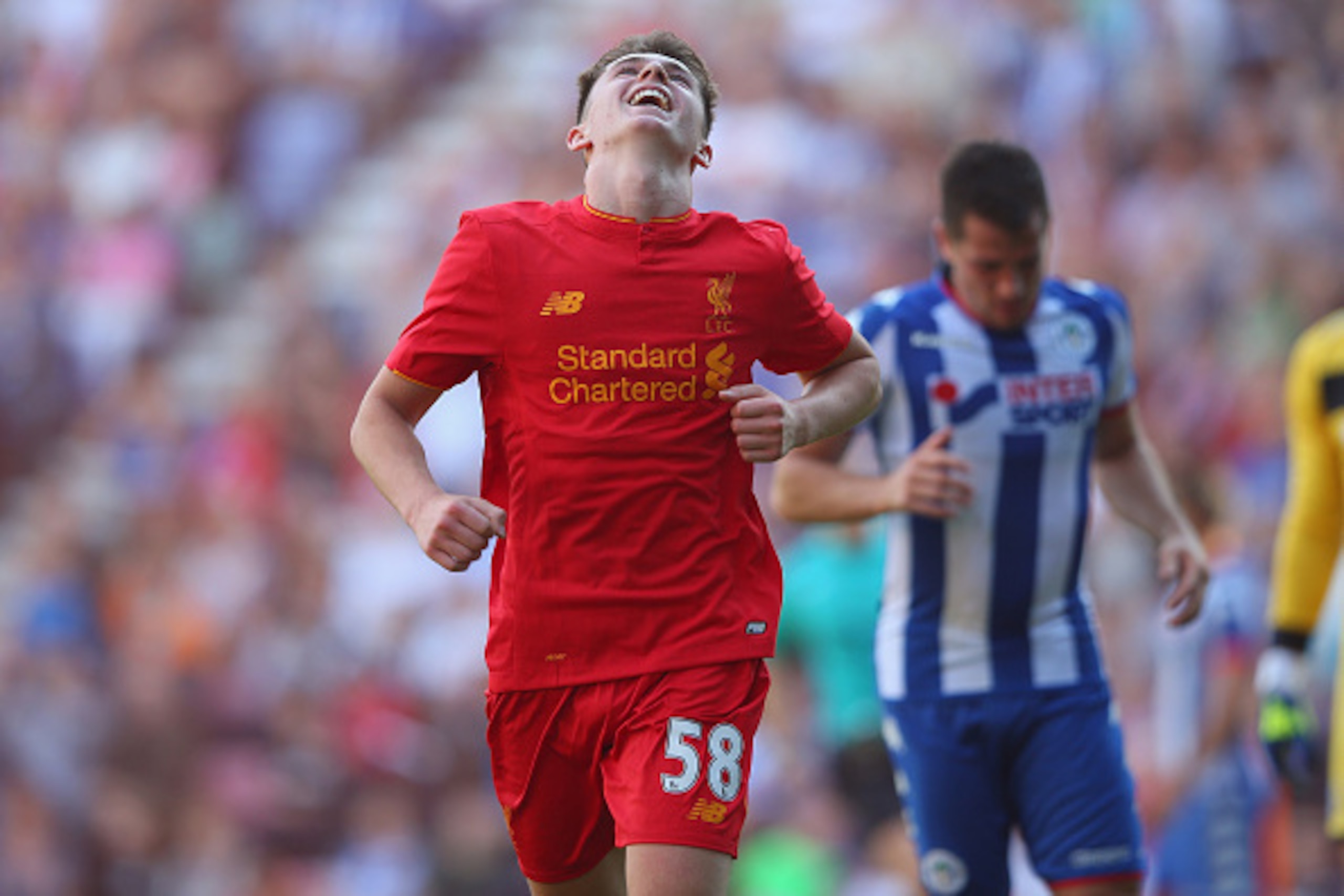 WIGAN, ENGLAND - JULY 17: Ben Woodburn of Liverpool celebrates after scoring the second goal during a pre-season friendly between Wigan Athletic and Liverpool at JJB Stadium on July 17, 2016 in Wigan, England. (Photo by Alex Livesey/Getty Images) WIGAN, ENGLAND - JULY 17: Ben Woodburn of Liverpool celebrates after scoring the second goal during a pre-season friendly between Wigan Athletic and Liverpool at JJB Stadium on July 17, 2016 in Wigan, England. (Photo by Alex Livesey/Getty Images)