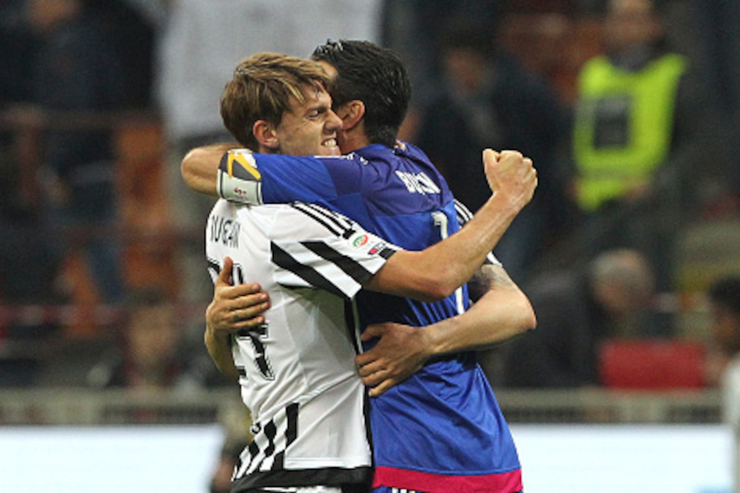 MILAN, ITALY - APRIL 09: Gianluigi Buffon (R) and Daniele Rugani (L) of Juventus FC celebrates a victory at the end of the Serie A match between AC Milan and Juventus FC at Stadio Giuseppe Meazza on April 9, 2016 in Milan, Italy. (Photo by Marco Luzzani/G