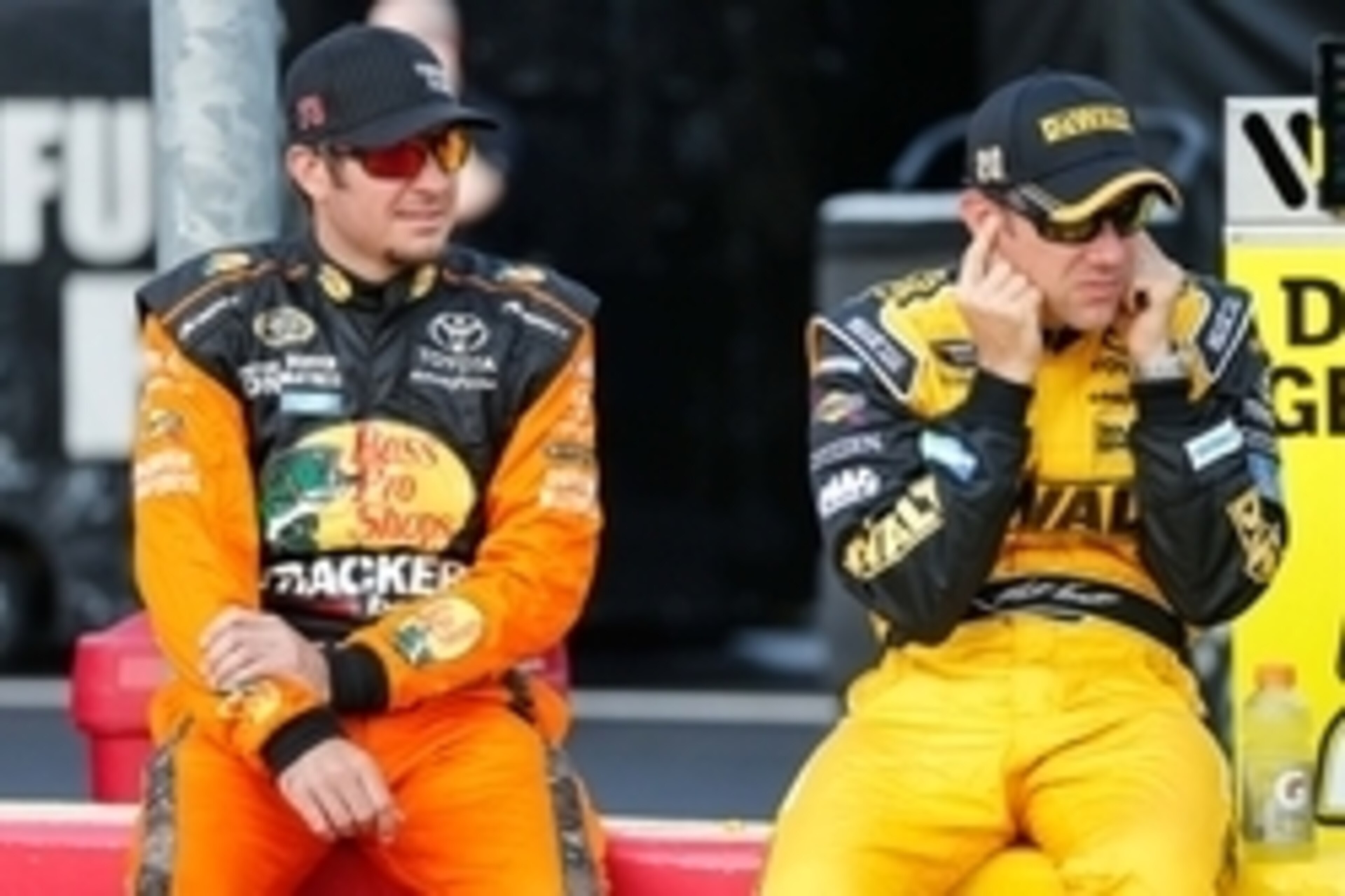 May 26, 2016; Concord, NC, USA; Pole winner driver Martin Truex Jr. (78) and driver Matt Kenseth (20) react to the starting of an engine during qualifying for the Coca-Cola 600 at Charlotte Motor Speedway. Mandatory Credit: Jim Dedmon-USA TODAY Sports