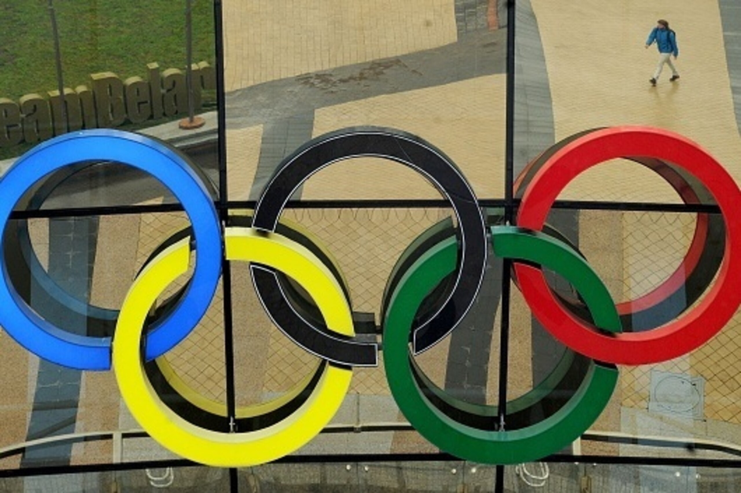 A man is reflected in the mirrored facade of the Belarus' Olympic Committee building in Minsk on July 18, 2016.
The International Canoe Federation has banned athletes from Belarus for a year from all International competitions including the Rio Olympics f