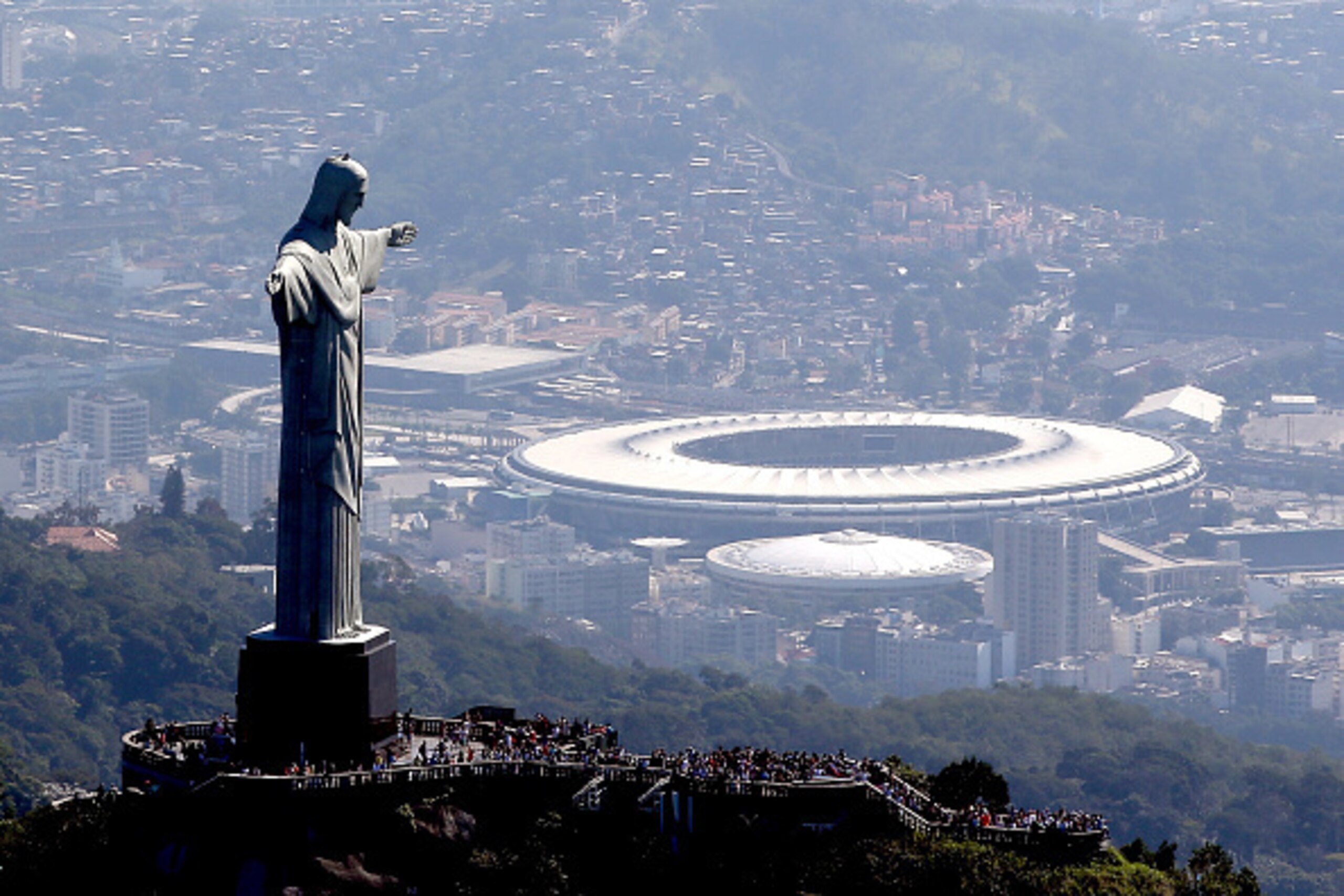 RIO DE JANEIRO, BRAZIL - JULY 04:  Aerial view of Christ the Redeemer with Maracana Stadium in the background  in preparation for the 2016 Olympic Games on July 4, 2016 in Rio de Janeiro, Brazil.  (Photo by Matthew Stockman/Getty Images)