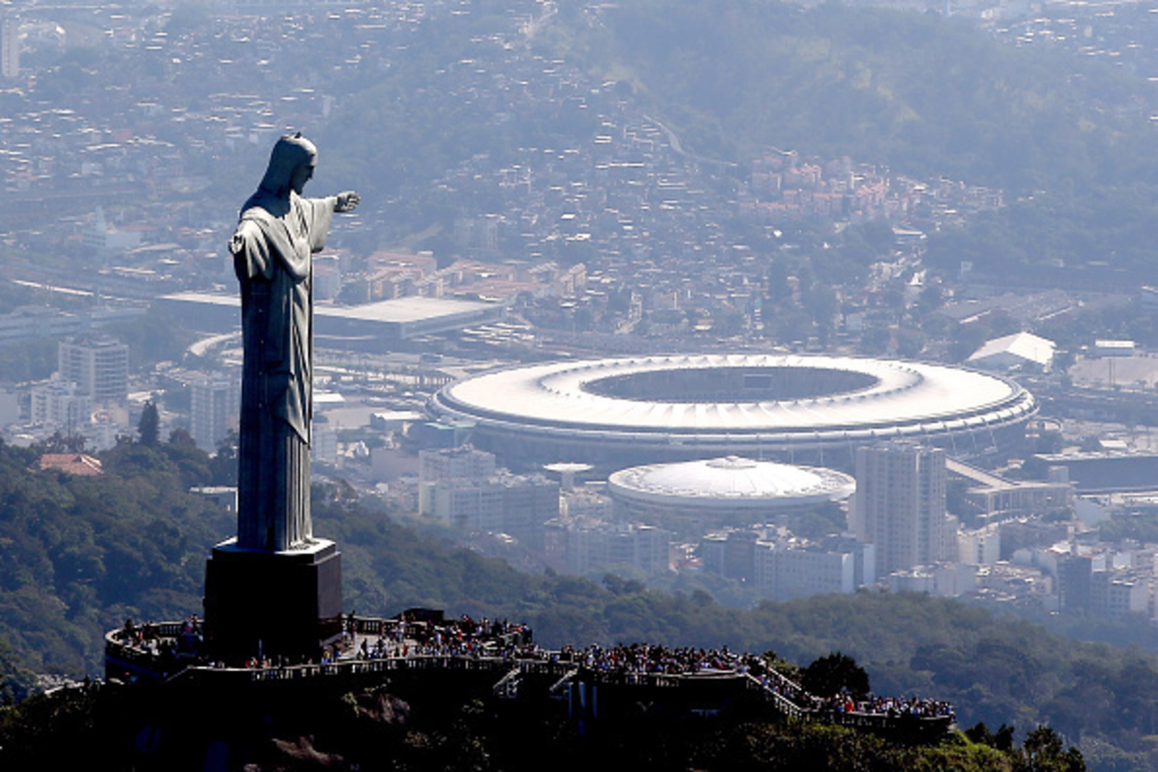 RIO DE JANEIRO, BRAZIL - JULY 04:  Aerial view of Christ the Redeemer with Maracana Stadium in the background  in preparation for the 2016 Olympic Games on July 4, 2016 in Rio de Janeiro, Brazil.  (Photo by Matthew Stockman/Getty Images)