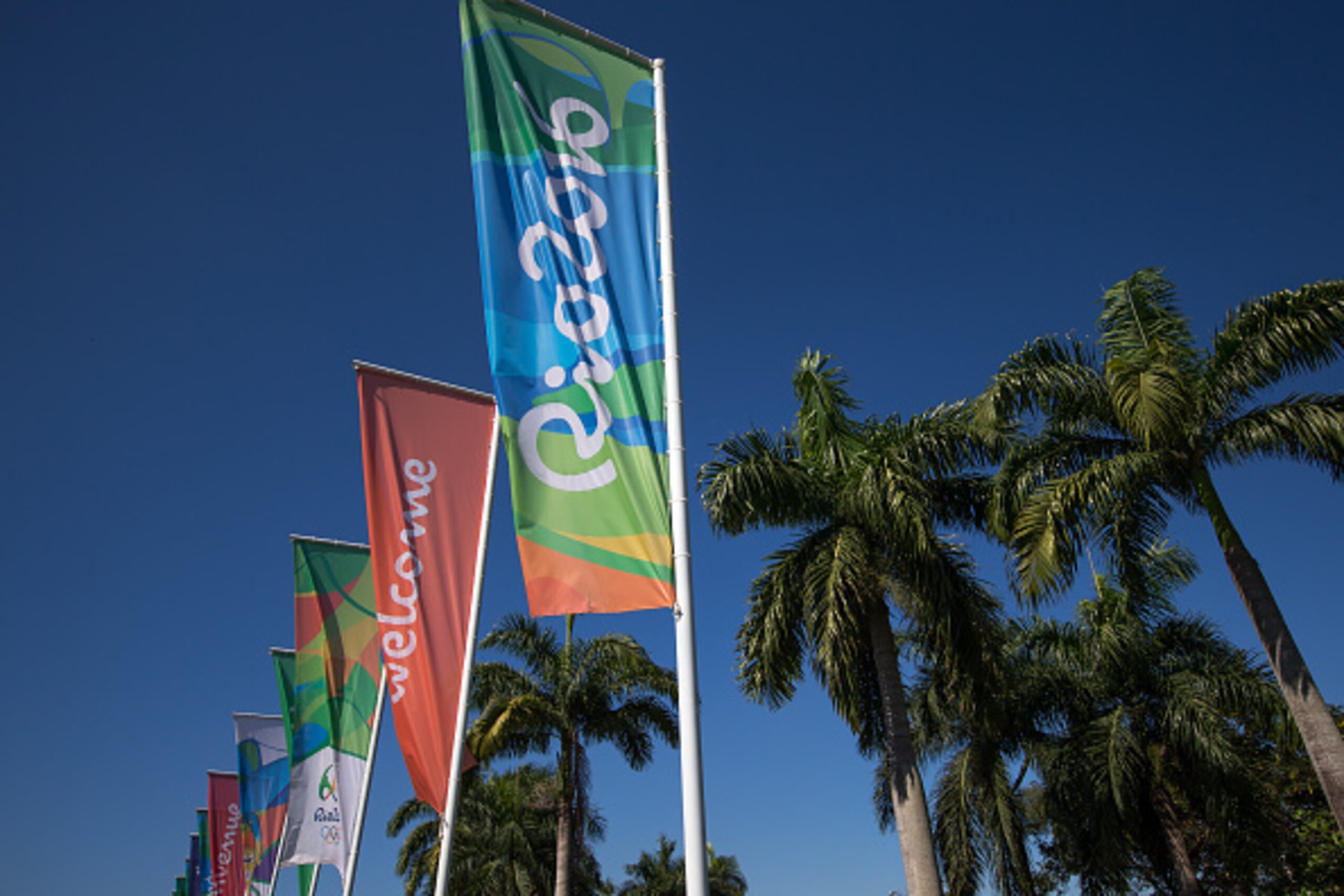 RIO DE JANEIRO, BRAZIL - JULY 05: Flags with the logo of Rio 2016 Olympic and Paralympic Games among others reading 'Welcome' in different languages are view near Antonio Carlos Jobim (Galeรฃo) International Airport on July 5, 2016 in Rio de Janeiro, Brazi RIO DE JANEIRO, BRAZIL - JULY 05: Flags with the logo of Rio 2016 Olympic and Paralympic Games among others reading 'Welcome' in different languages are view near Antonio Carlos Jobim (Galeรฃo) International Airport on July 5, 2016 in Rio de Janeiro, Brazi