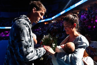 OMAHA, NE - JULY 01:  Michael Phelps (L) of the United States celebrates with his fiance Nicole Johnson (R) and their son Boomer (C) after finishing first in the final heat for the Men's 200 Meter Individual Medley during Day Six of the 2016 U.S. Olympic 