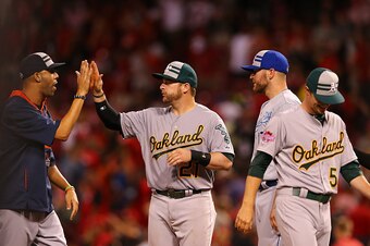 CINCINNATI, OH - JULY 14:  American League All-Star David Price #14 of the Detroit Tigers, American League All-Star Sonny Gray #54 of the Oakland Athletics, and American League All-Star Stephen Vogt #21 of the Oakland Athletics celebrate after defeating t