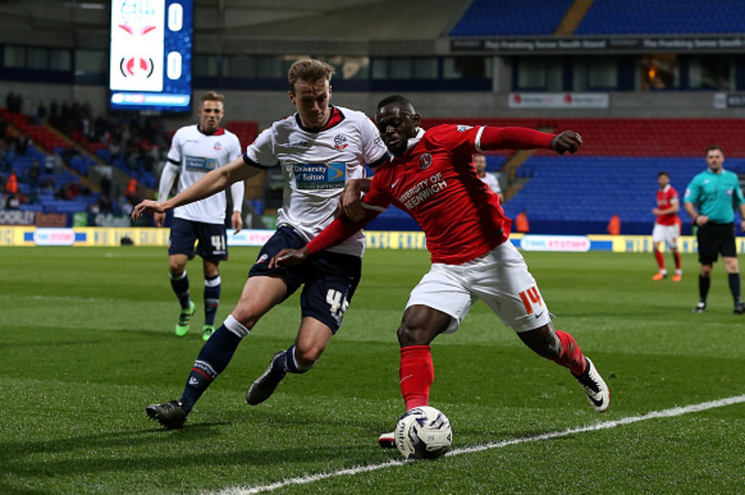 BOLTON, ENGLAND - APRIL 19:  Rob Holding of Bolton Wanderers battles with Igor Vetokele of Charlton Athletic during the Sky Bet Championship match between Bolton Wanderers and Charlton Athletic at Reebok Stadium on April 19, 2016 in Bolton, United Kingdom