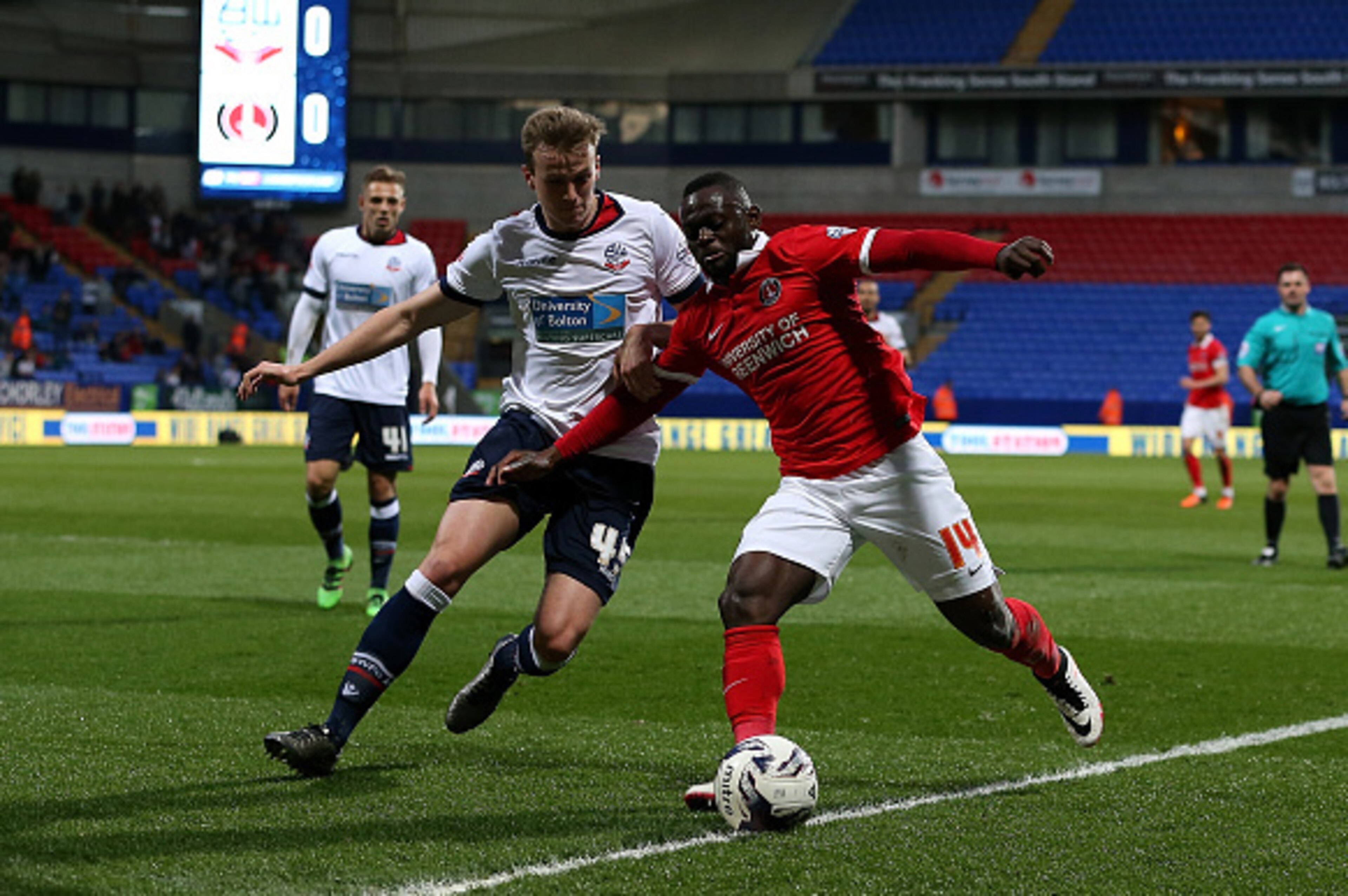 BOLTON, ENGLAND - APRIL 19:  Rob Holding of Bolton Wanderers battles with Igor Vetokele of Charlton Athletic during the Sky Bet Championship match between Bolton Wanderers and Charlton Athletic at Reebok Stadium on April 19, 2016 in Bolton, United Kingdom
