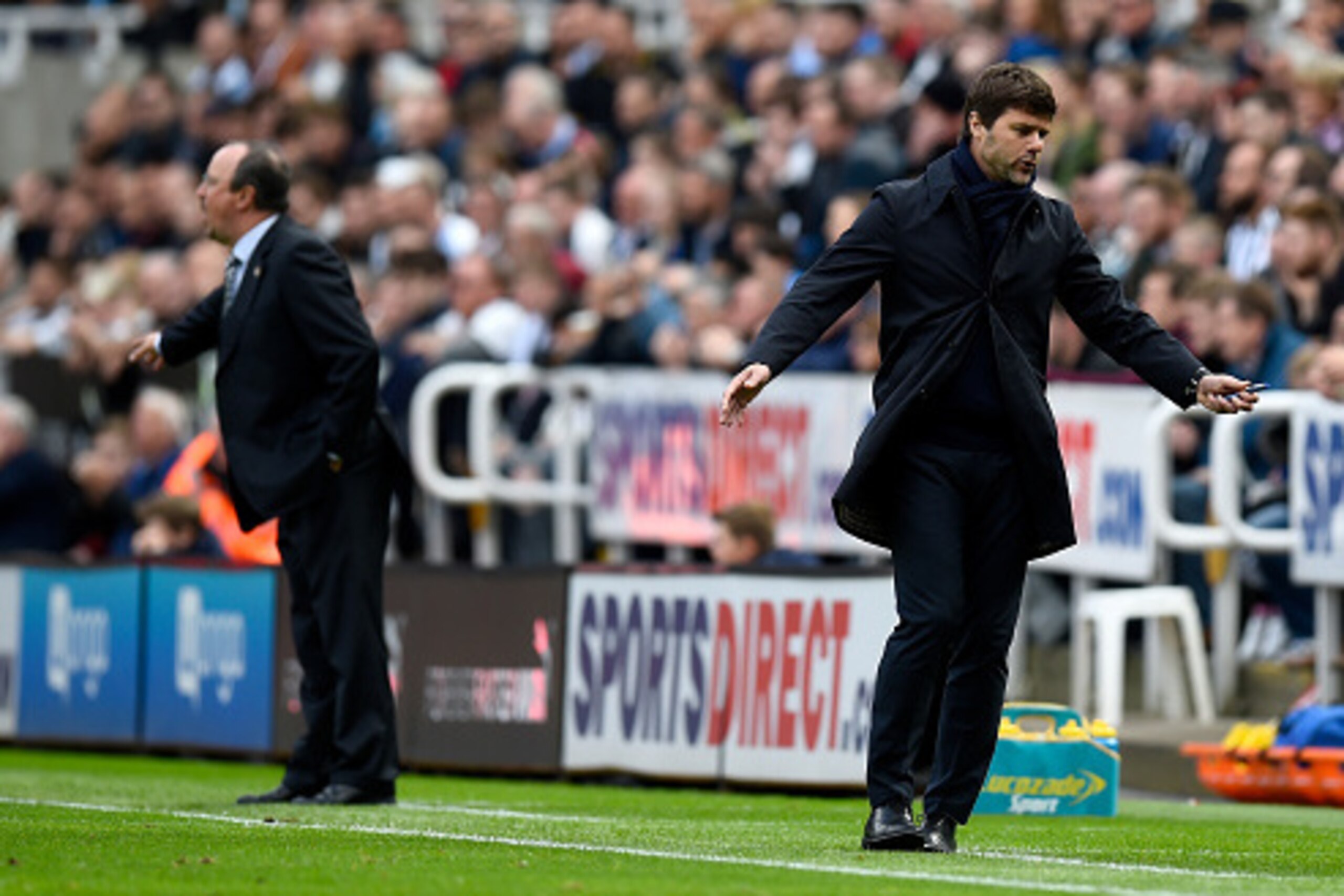 NEWCASTLE UPON TYNE, ENGLAND - MAY 15: Tottenham manager Mauricio Pochettino reacts as manager Rafa Benitez (l) looks on during the Premier League match between Newcastle United and Tottenham Hotspur at St James' Park on May 15, 2016 in Newcastle upon Ty NEWCASTLE UPON TYNE, ENGLAND - MAY 15: Tottenham manager Mauricio Pochettino reacts as manager Rafa Benitez (l) looks on during the Premier League match between Newcastle United and Tottenham Hotspur at St James' Park on May 15, 2016 in Newcastle upon Ty