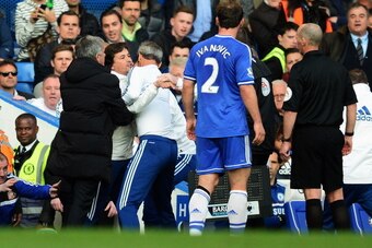 LONDON, ENGLAND - APRIL 19:  Chelsea coach Rui Faria is held back by Jose Mourinho and other members of coaching staff as he confronts match referee Mike Dean during the Barclays Premier League match between Chelsea and Sunderland at Stamford Bridge on Ap