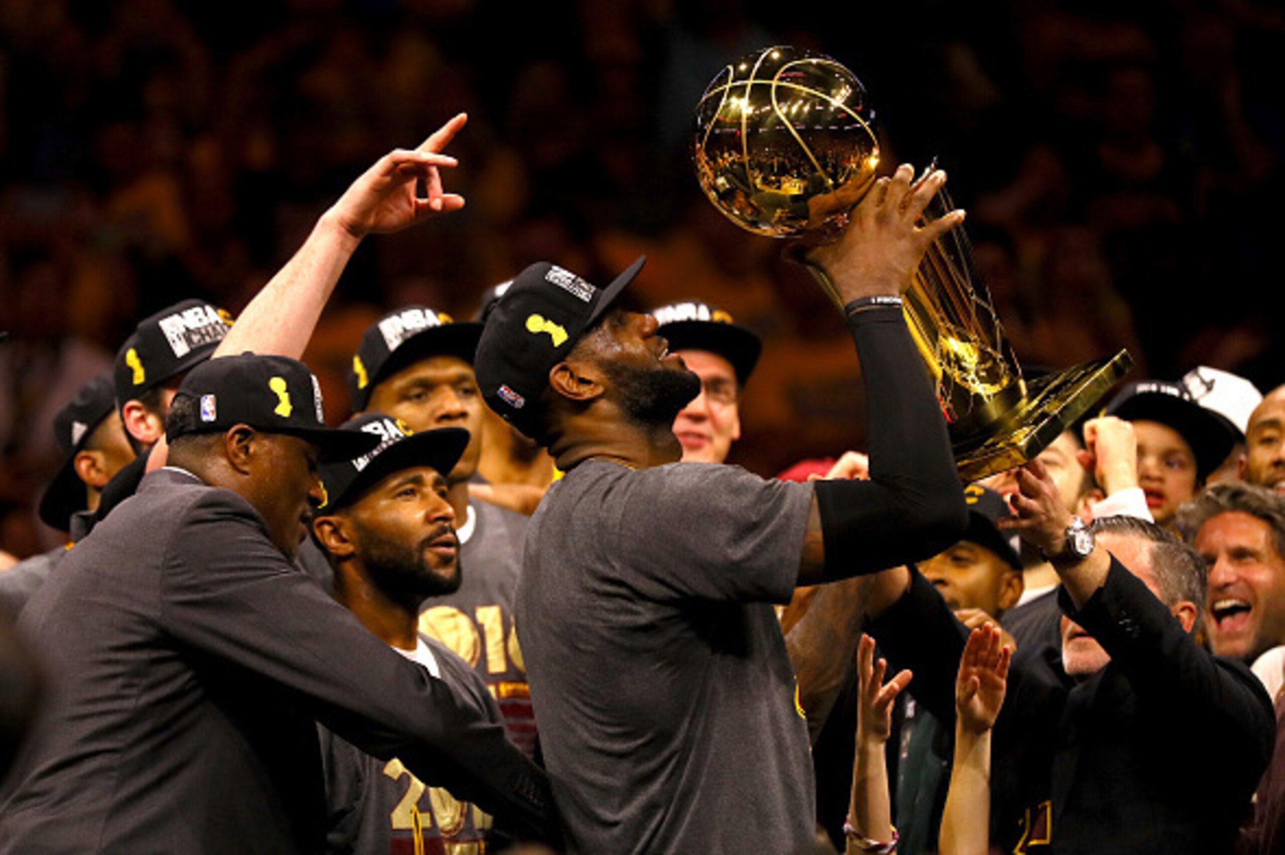 OAKLAND, CA - JUNE 19:  LeBron James #23 of the Cleveland Cavaliers holds the Larry O'Brien Championship Trophy after defeating the Golden State Warriors 93-89 in Game 7 of the 2016 NBA Finals at ORACLE Arena on June 19, 2016 in Oakland, California. NOTE 