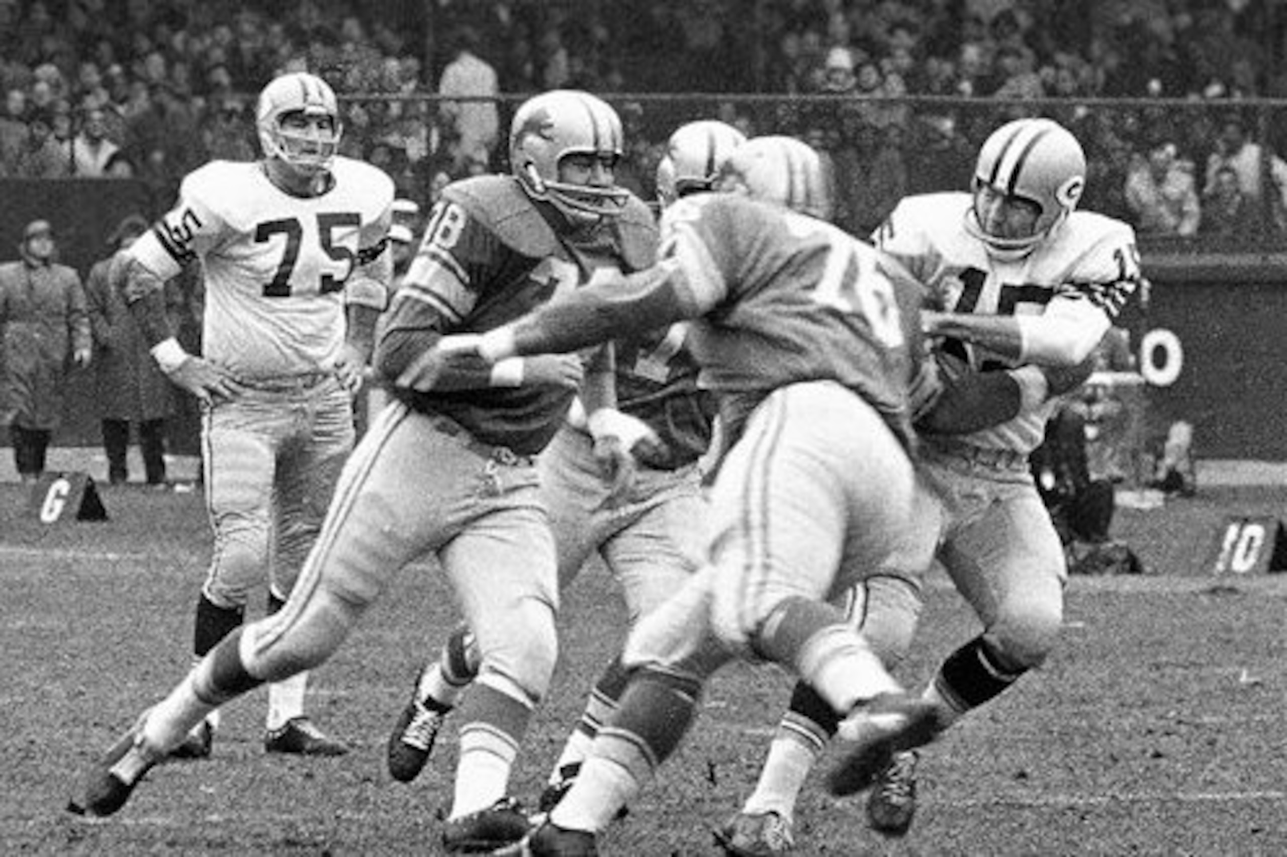Roger Brown (#76) sacking Bart Starr. Brown was one of the players acquired in the "cursed" Bobby Layne trade.