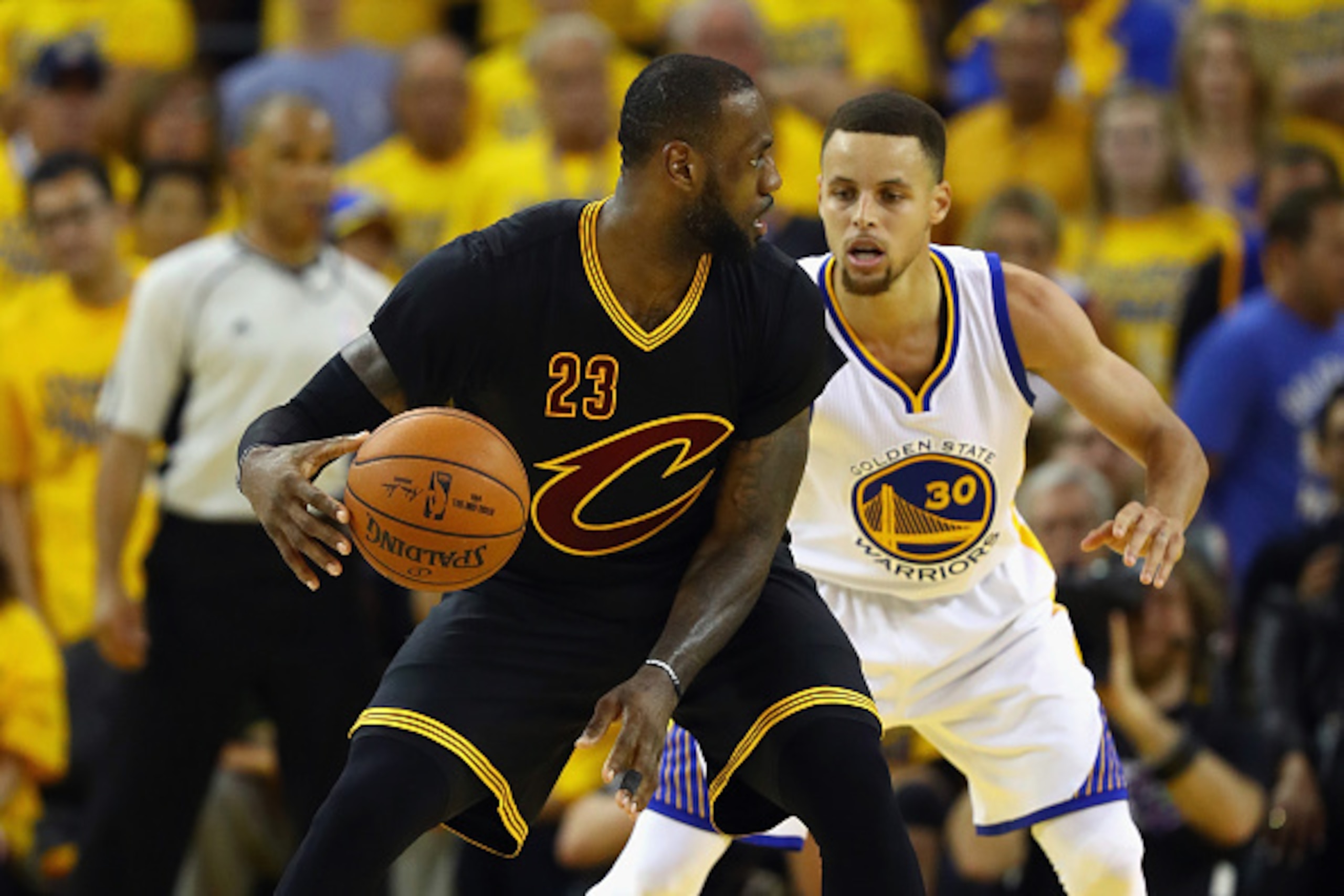 OAKLAND, CA - JUNE 19:  LeBron James #23 of the Cleveland Cavaliers handles the ball against Stephen Curry #30 of the Golden State Warriors during the second half in Game 7 of the 2016 NBA Finals at ORACLE Arena on June 19, 2016 in Oakland, California. NO