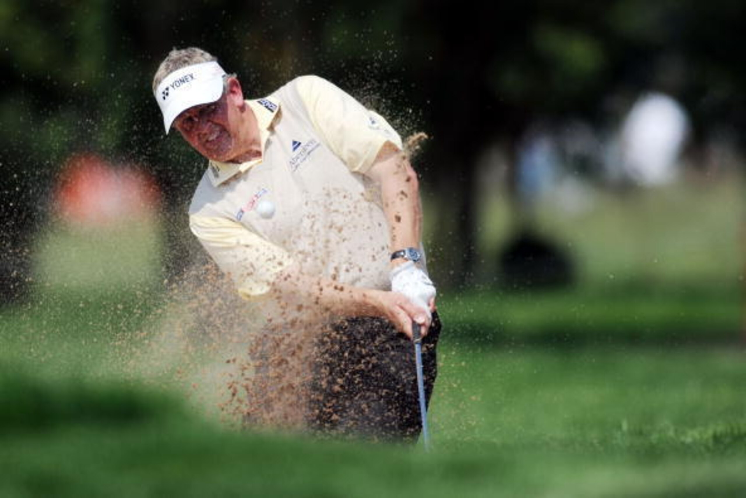 MUNICH, GERMANY - JUNE 27:  Colin Montgomery of Scotland plays a bunker shot on the 15th hole during the final round of the BMW International Open at the Munich North Eichenried Golf Club on June 27, 2010, in Munich, Germany.  (Photo by Krafft Angerer/Get