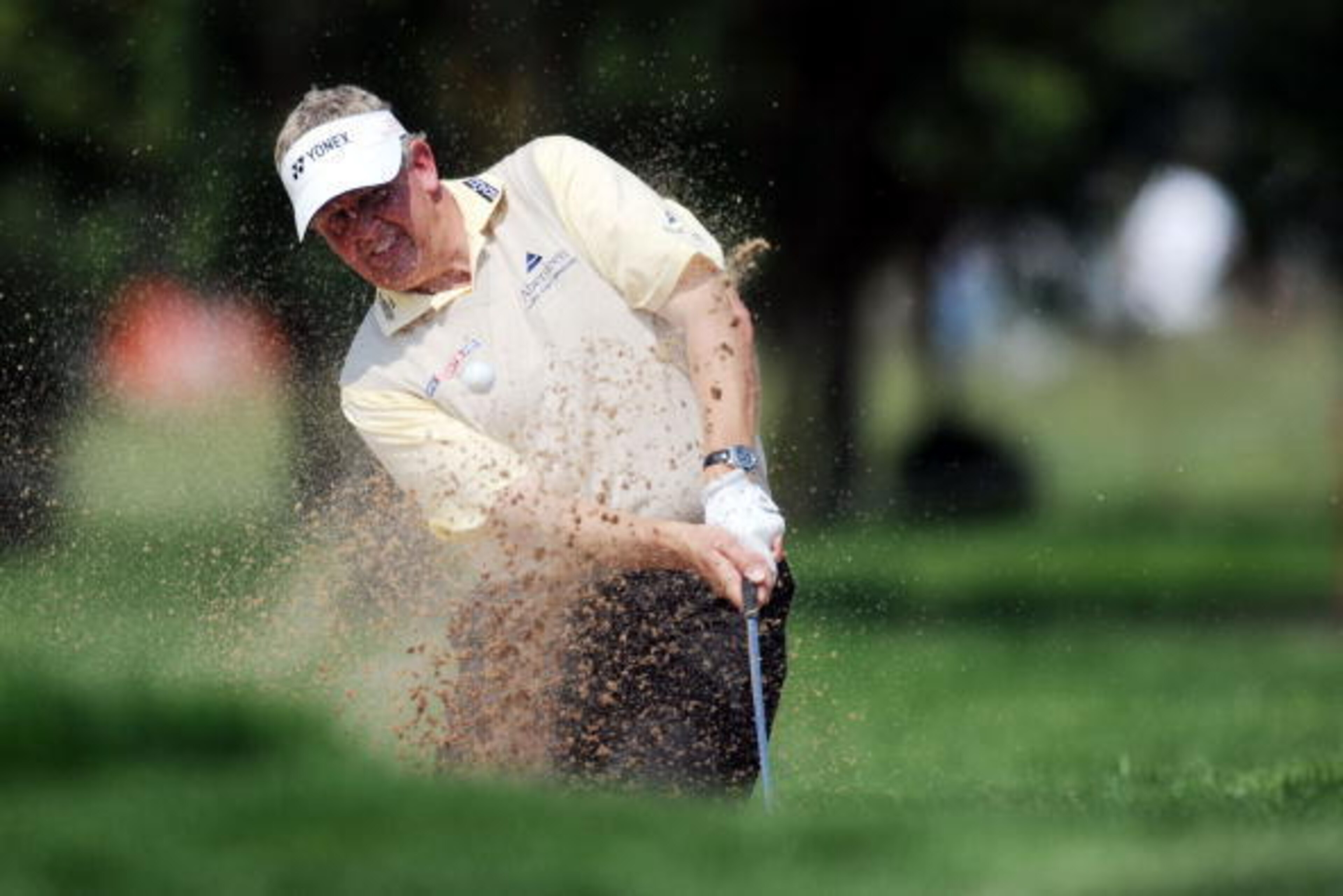 MUNICH, GERMANY - JUNE 27:  Colin Montgomery of Scotland plays a bunker shot on the 15th hole during the final round of the BMW International Open at the Munich North Eichenried Golf Club on June 27, 2010, in Munich, Germany.  (Photo by Krafft Angerer/Get
