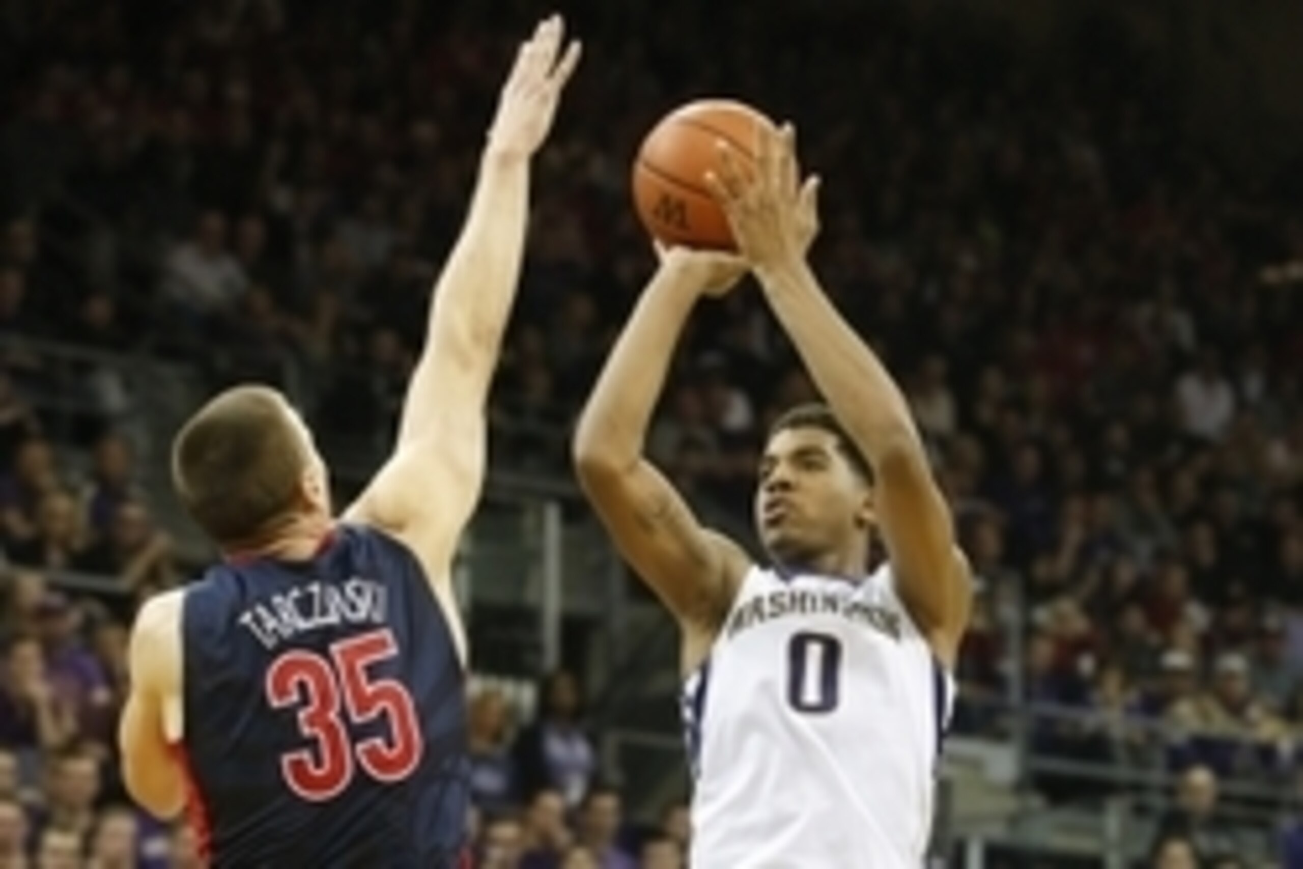 Feb 6, 2016; Seattle, WA, USA; Washington Huskies forward Marquese Chriss (0) shoots over Arizona Wildcats center Kaleb Tarczewski (35) during the second half at Alaska Airlines Arena. Arizona won 77-72. Mandatory Credit: Jennifer Buchanan-USA TODAY Sport