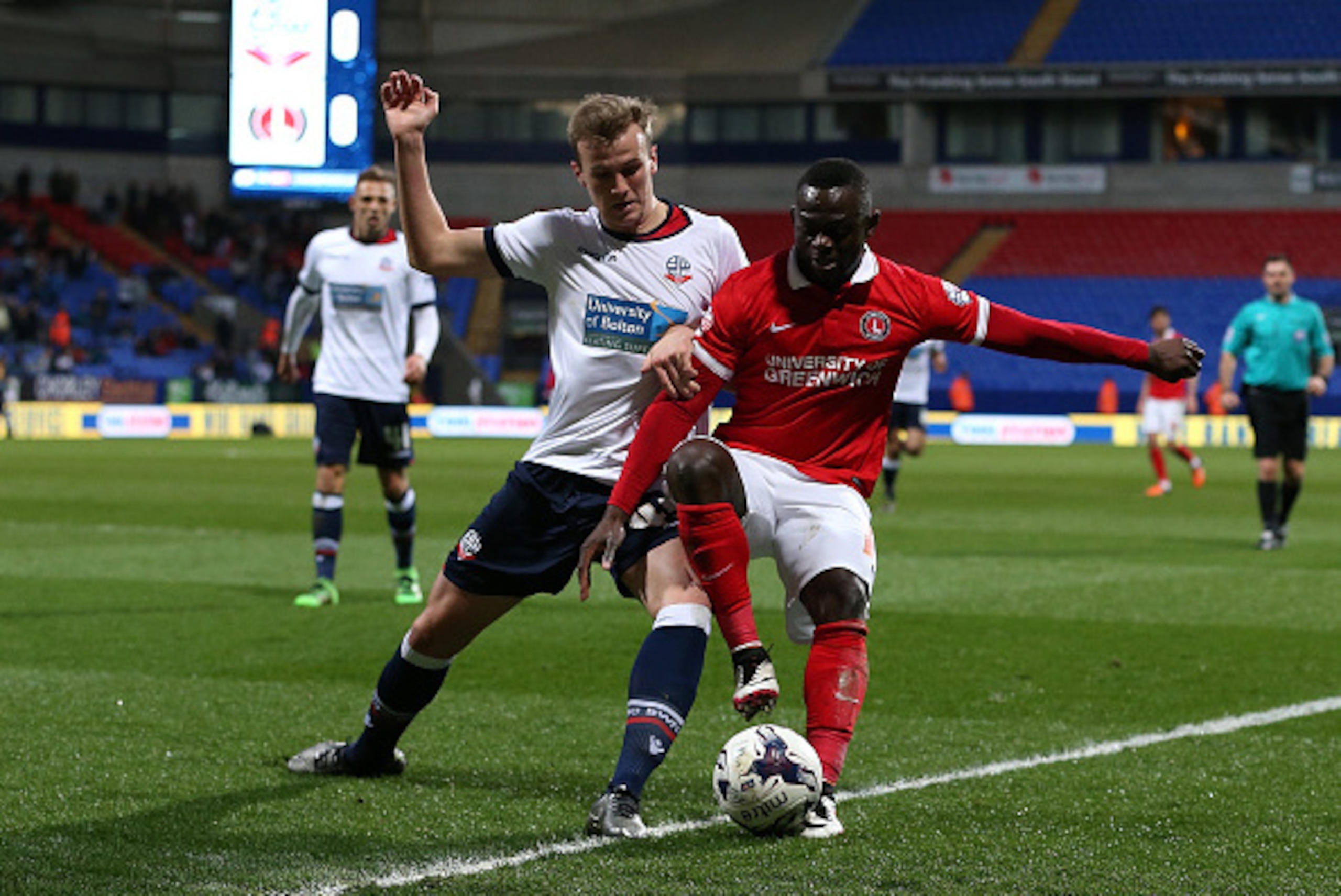 BOLTON, ENGLAND - APRIL 19: Rob Holding of Bolton Wanderers battles with Igor Vetokele of Charlton Athletic during the Sky Bet Championship match between Bolton Wanderers and Charlton Athletic at Reebok Stadium on April 19, 2016 in Bolton, United Kingdom BOLTON, ENGLAND - APRIL 19: Rob Holding of Bolton Wanderers battles with Igor Vetokele of Charlton Athletic during the Sky Bet Championship match between Bolton Wanderers and Charlton Athletic at Reebok Stadium on April 19, 2016 in Bolton, United Kingdom