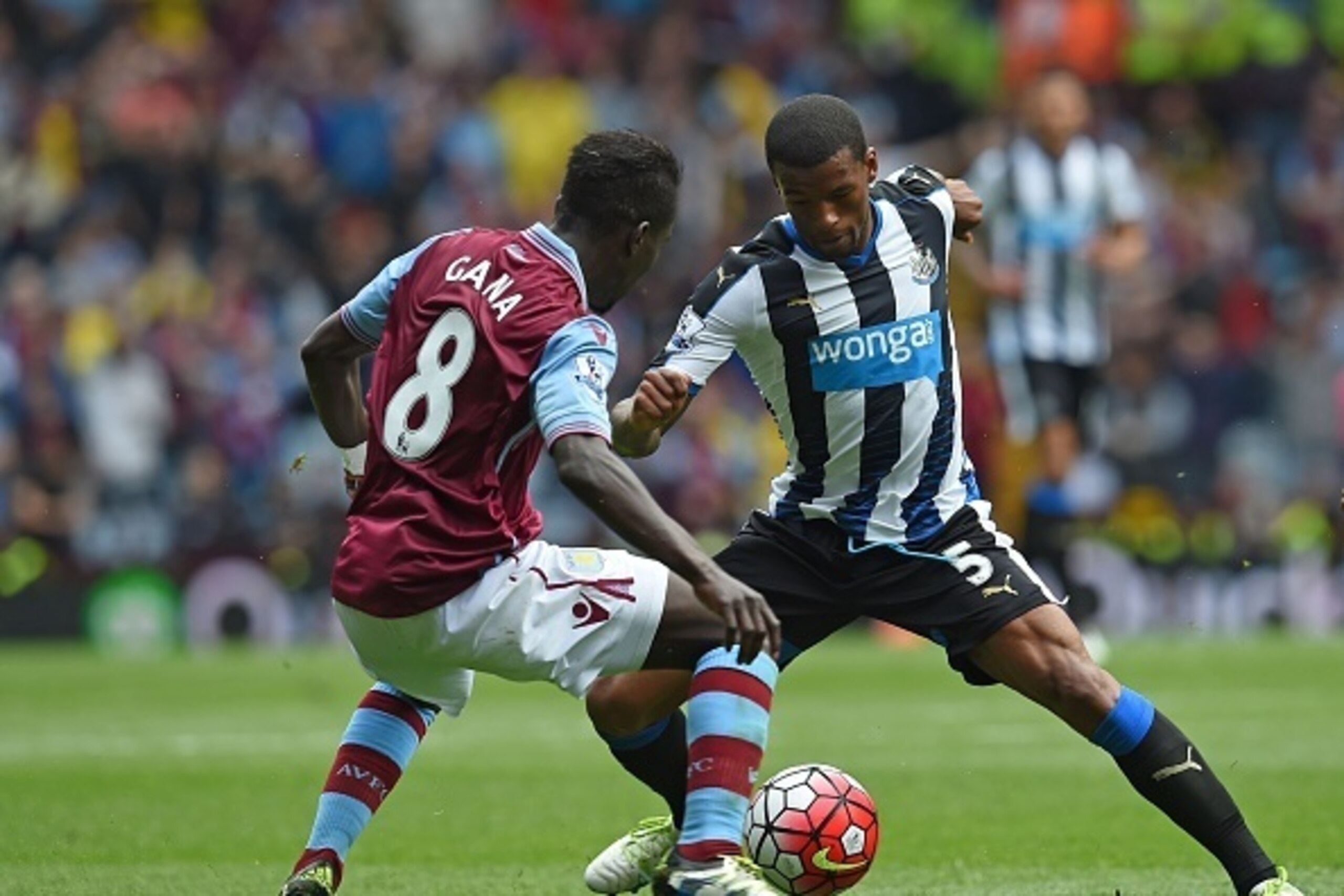 Newcastle United's Dutch midfielder Georginio Wijnaldum (R) vies with Aston Villa's Senegalese midfielder Idrissa Gueye during the English Premier League football match between Aston Villa and Newcastle United at Villa Park in Birmingham, central England 