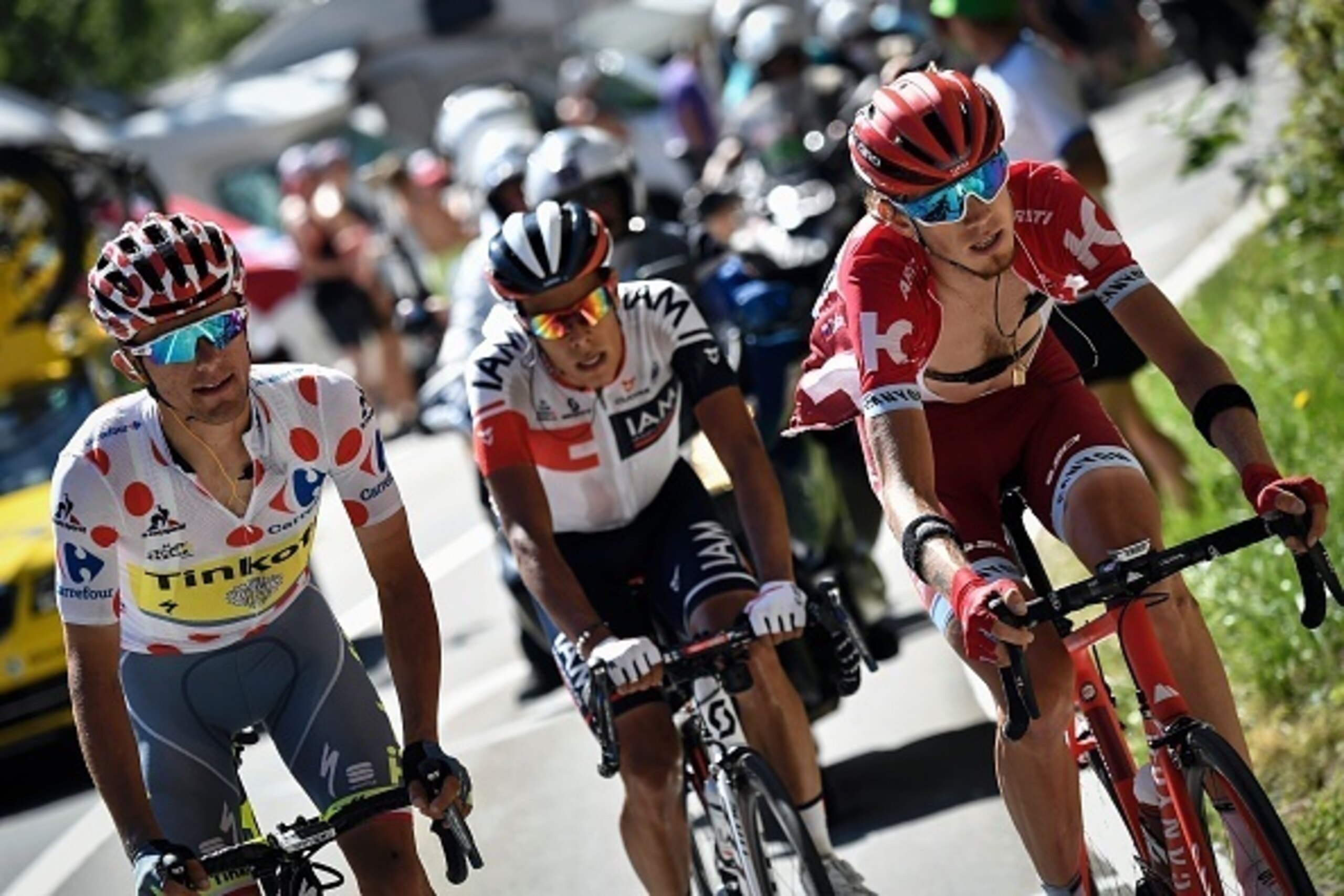 (From L) Poland's Rafal Majka, wearing the best climber's polka dot jersey, Colombia's Jarlinson Pantano and Russia's Ilnur Zakarin ride in a breakaway during the 184,5 km seventeenth stage of the 103rd edition of the Tour de France cycling race on July 2