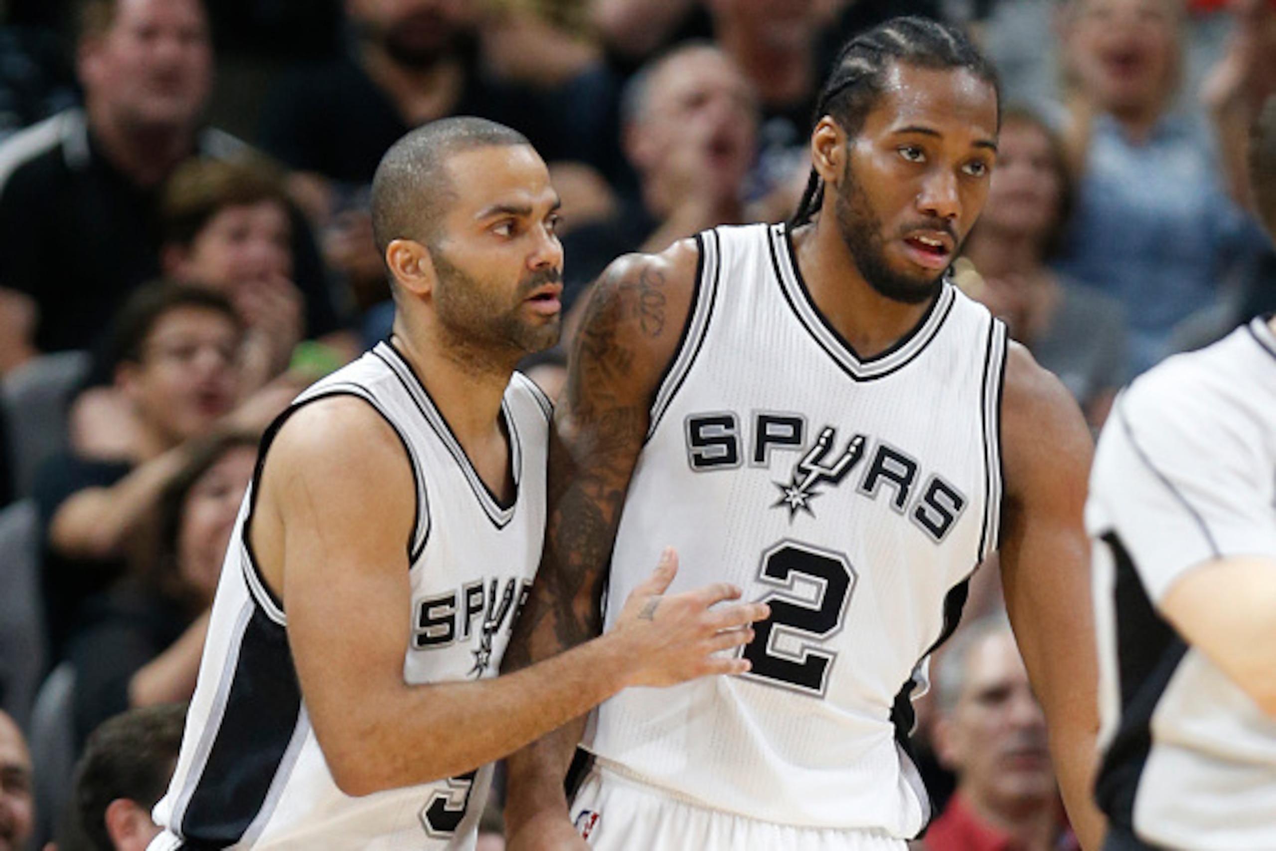 SAN ANTONIO,TX - MARCH 15: Tony Parker #9 of the San Antonio Spurs congratulates Kawhi Leonard #2 of the San Antonio Spurs after three  against the Los Angeles Clippers at AT&T Center on March 15, 2016 in San Antonio, Texas.  NOTE TO USER: User expressly 