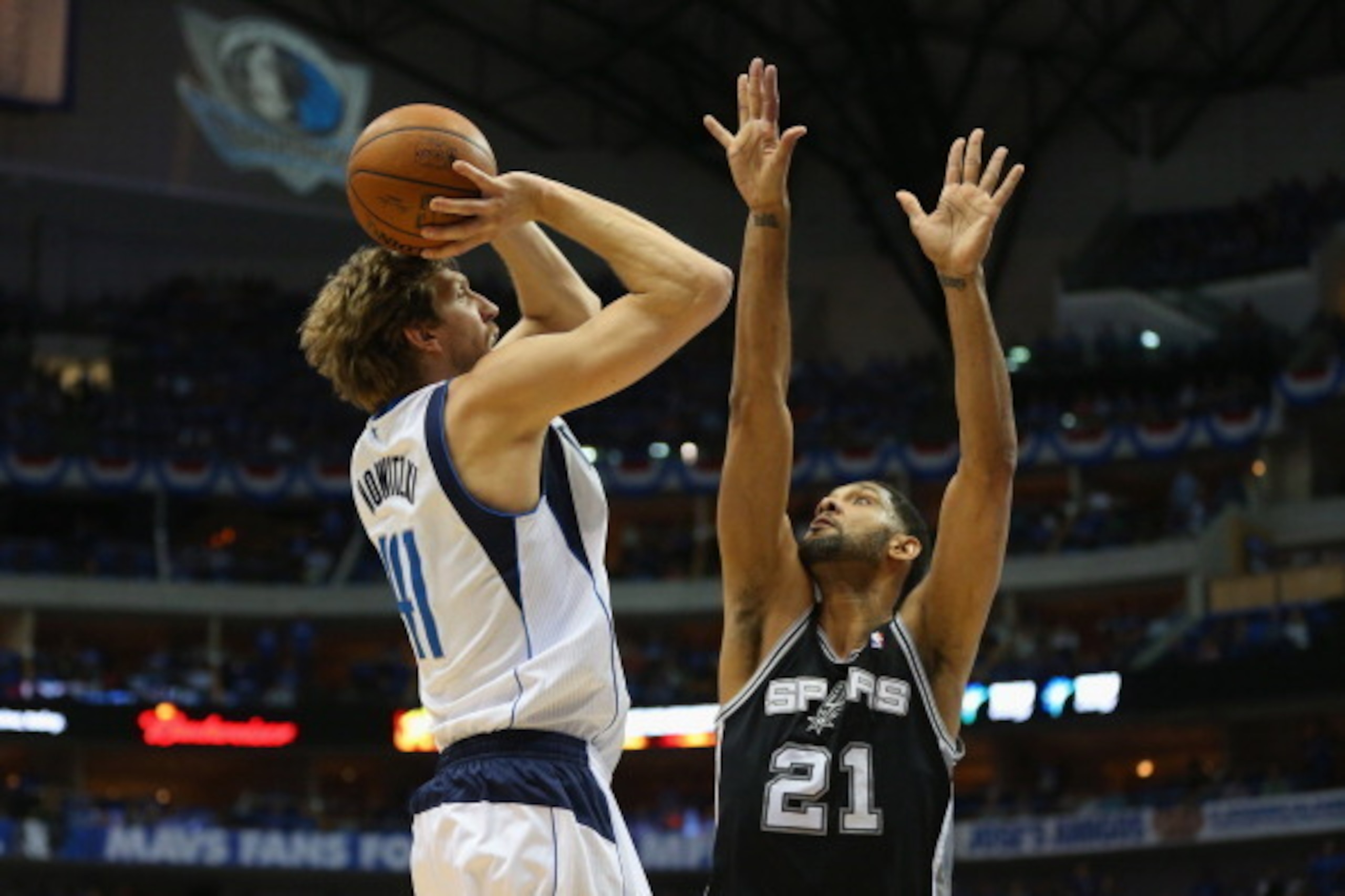DALLAS, TX - MAY 02:  Dirk Nowitzki #41 of the Dallas Mavericks takes a shot against Tim Duncan #21 of the San Antonio Spurs in Game Six of the Western Conference Quarterfinals during the 2014 NBA Playoffs at American Airlines Center on May 2, 2014 in Dal