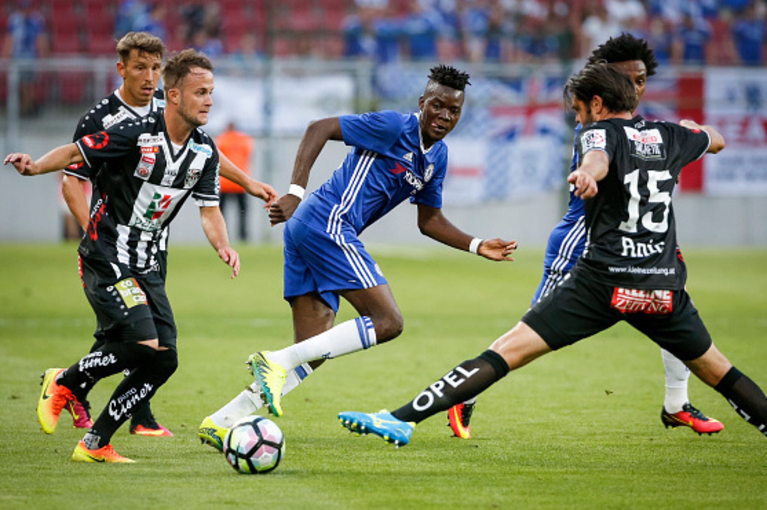 VELDEN, AUSTRIA - JULY 20: Bertrand Traore (C) of Chelsea in action against Nemanja Rnic (R) and Christian Klem (L) of WAC RZ Pellets during the international friendly match between WAC RZ Pellets and Chelsea F.C. at Worthersee Stadion on July 20, 2016 i VELDEN, AUSTRIA - JULY 20: Bertrand Traore (C) of Chelsea in action against Nemanja Rnic (R) and Christian Klem (L) of WAC RZ Pellets during the international friendly match between WAC RZ Pellets and Chelsea F.C. at Worthersee Stadion on July 20, 2016 i