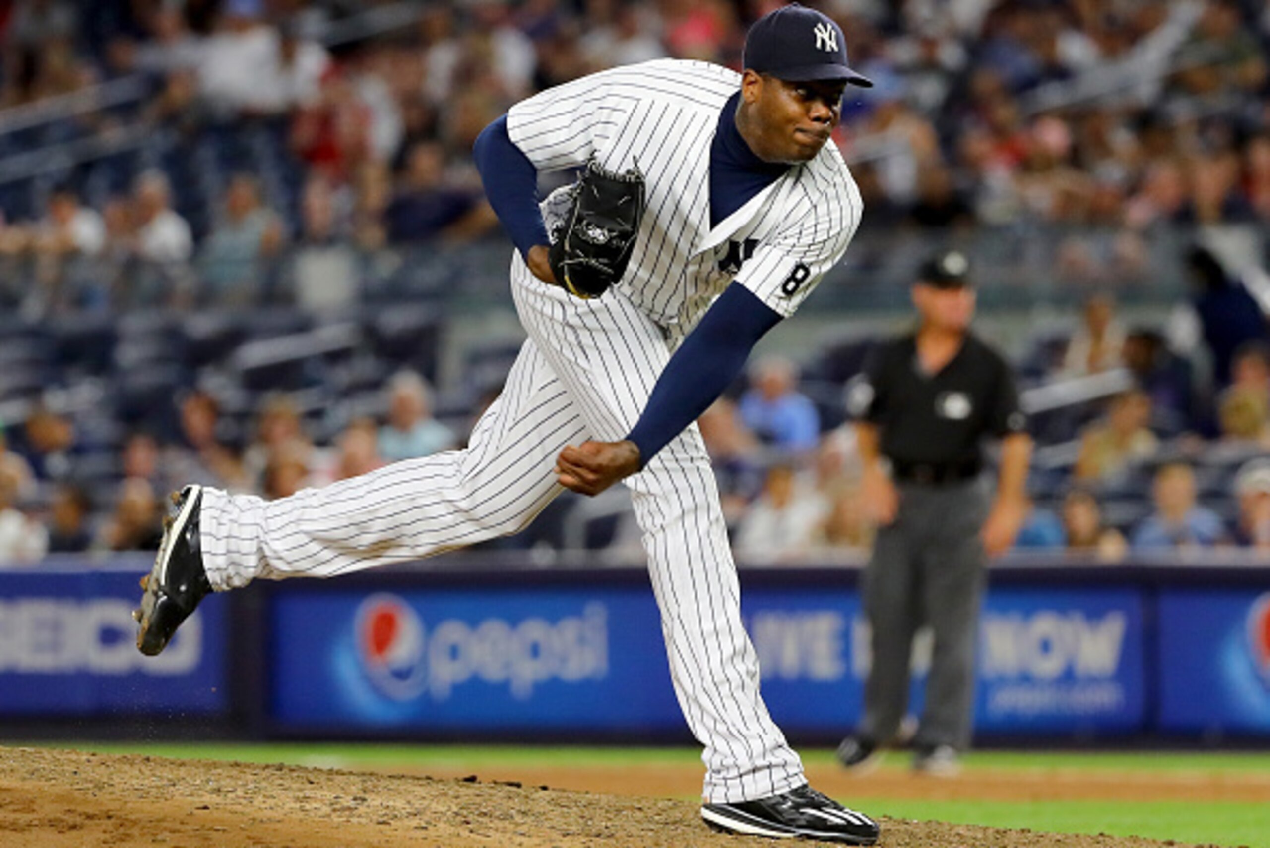 NEW YORK, NY - JULY 17:  Aroldis Chapman #54 of the New York Yankees delivers a pitch in the ninth inning against the Boston Red Sox at Yankee Stadium on July 17, 2016 in the Bronx borough of New York City.  (Photo by Elsa/Getty Images)