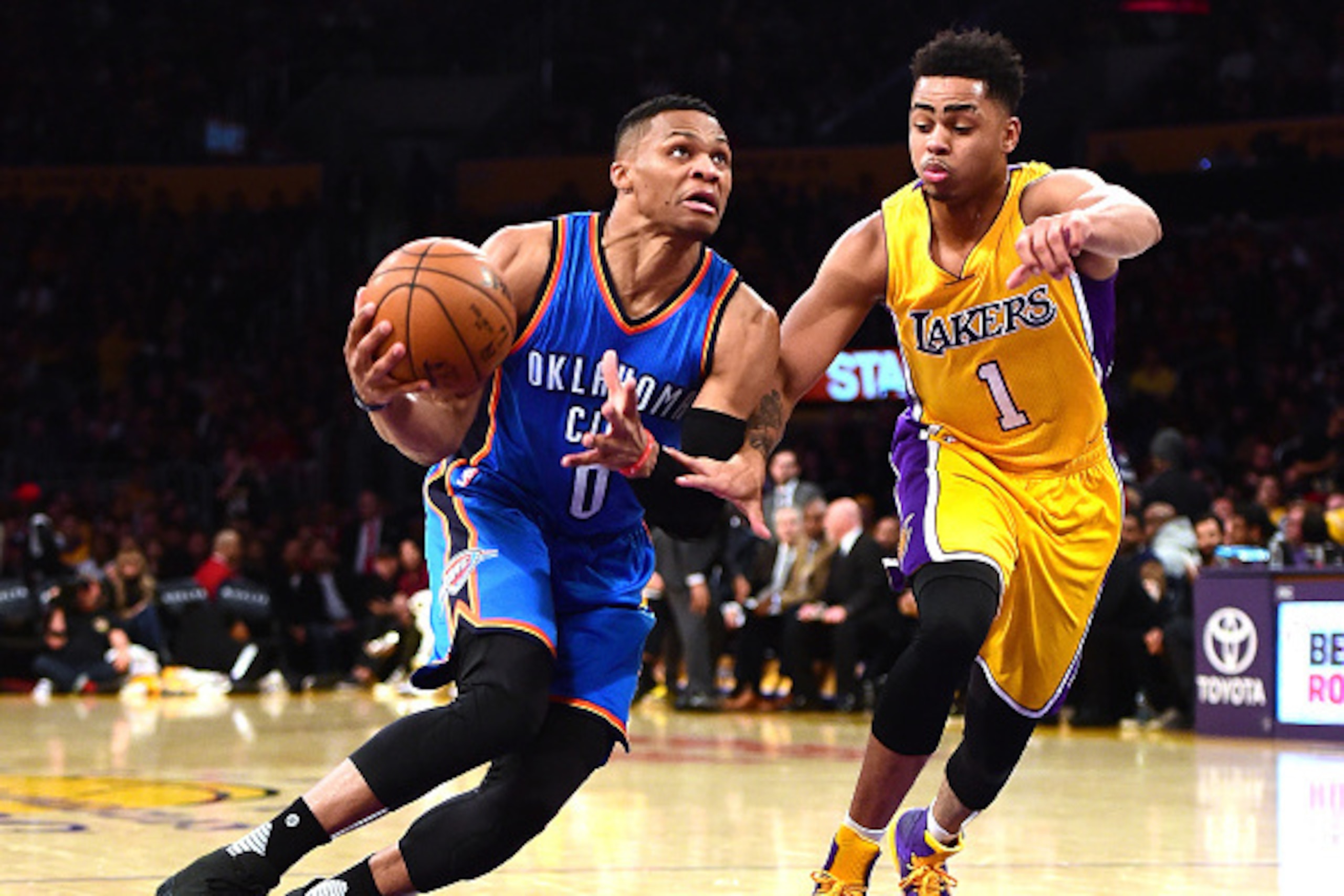 LOS ANGELES, CA - DECEMBER 23:  Russell Westbrook #0 of the Oklahoma City Thunder drives past D'Angelo Russell #1 of the Los Angeles Lakers during the first half at Staples Center on December 23, 2015 in Los Angeles, California.  NOTE TO USER: User expres