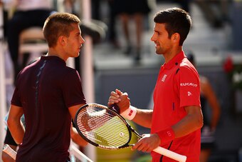 MADRID, SPAIN - MAY 04:  Novak Djokovic of Serbia shakes hands at the net after his straight sets victory against Borna Coric of Croatia in their second round match during day five of the Mutua Madrid Open tennis tournament at the Caja Magica on May 04, 2