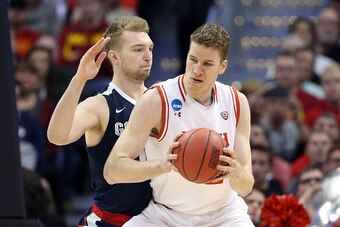 DENVER, CO - MARCH 19:  Jakob Poeltl #42 of the Utah Utes drives the ball against Domantas Sabonis #11 of the Gonzaga Bulldogs during the second round of the 2016 NCAA Men's Basketball Tournament at the Pepsi Center on March 19, 2016 in Denver, Colorado. 
