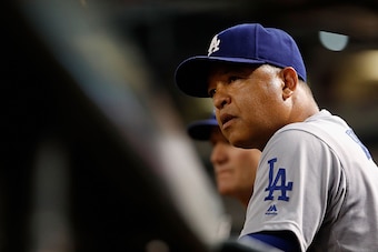 PHOENIX, AZ - JULY 16:  Manager Dave Roberts #30 of the Los Angeles Dodgers watches from the dugout during the MLB game against the Arizona Diamondbacks at Chase Field on August 16, 2016 in Phoenix, Arizona.  (Photo by Christian Petersen/Getty Images)