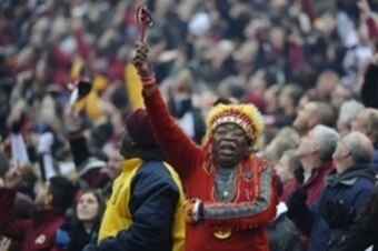 Nov 16, 2014; Landover, MD, USA; Washington Redskins fan Chief Zee cheers before the game between the Washington Redskins and the Tampa Bay Buccaneers at FedEx Field. Mandatory Credit: Brad Mills-USA TODAY Sports