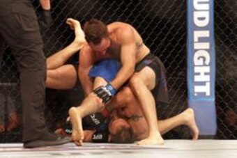 Jul 13, 2016; Sioux Falls, SD, USA; Tony Ferguson (red gloves) fights against Lando Vannata (blue gloves) during UFC Fight Night at Denny Sanford Premier Center. Mandatory Credit: Brad Rempel-USA TODAY Sports