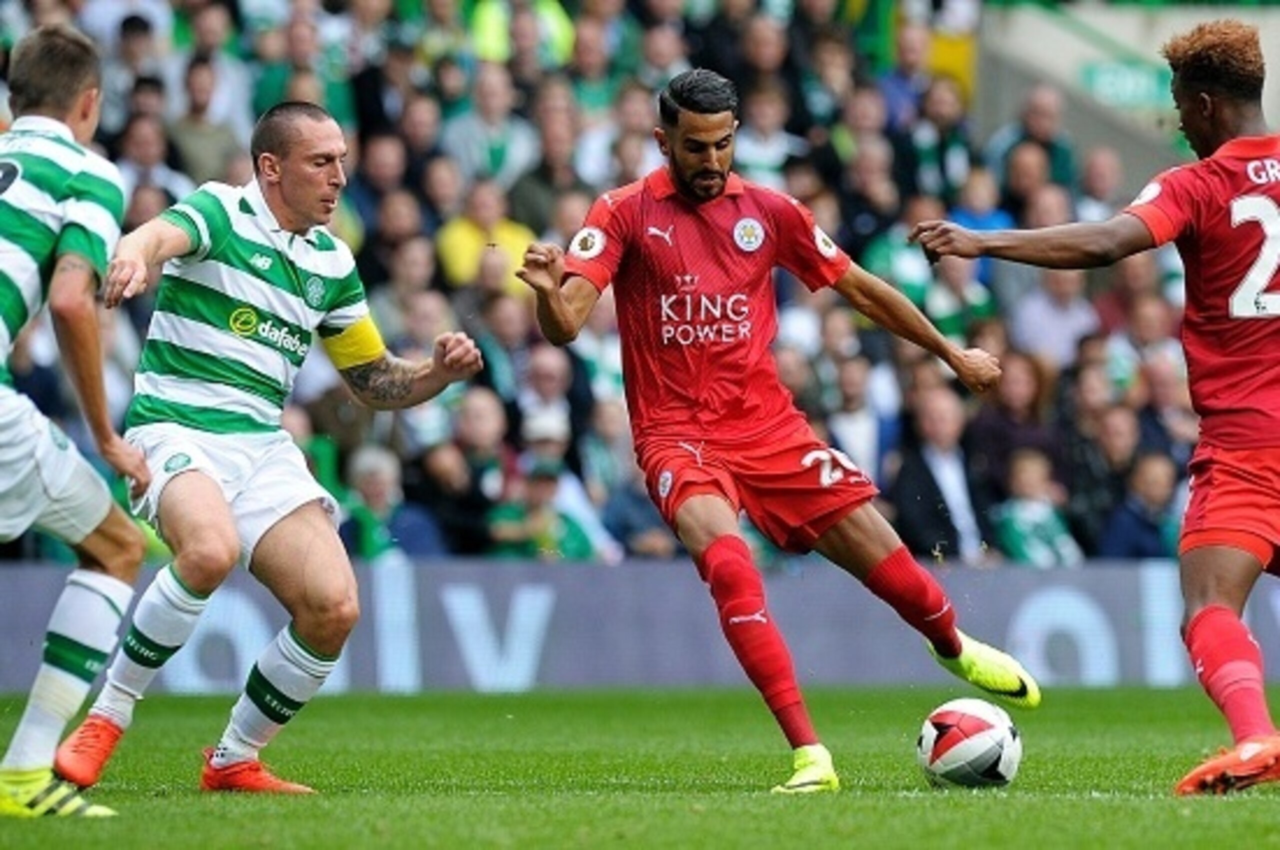 Leicester City's Algerian midfielder Riyad Mahrez (2nd R) vies with Celtic's Scottish midfielder Scott Brown (2nd L) and Celtic's Swedish defender Mikael Lustig (L) during the International Champions Cup football match between Scottish Premiership champio Leicester City's Algerian midfielder Riyad Mahrez (2nd R) vies with Celtic's Scottish midfielder Scott Brown (2nd L) and Celtic's Swedish defender Mikael Lustig (L) during the International Champions Cup football match between Scottish Premiership champio
