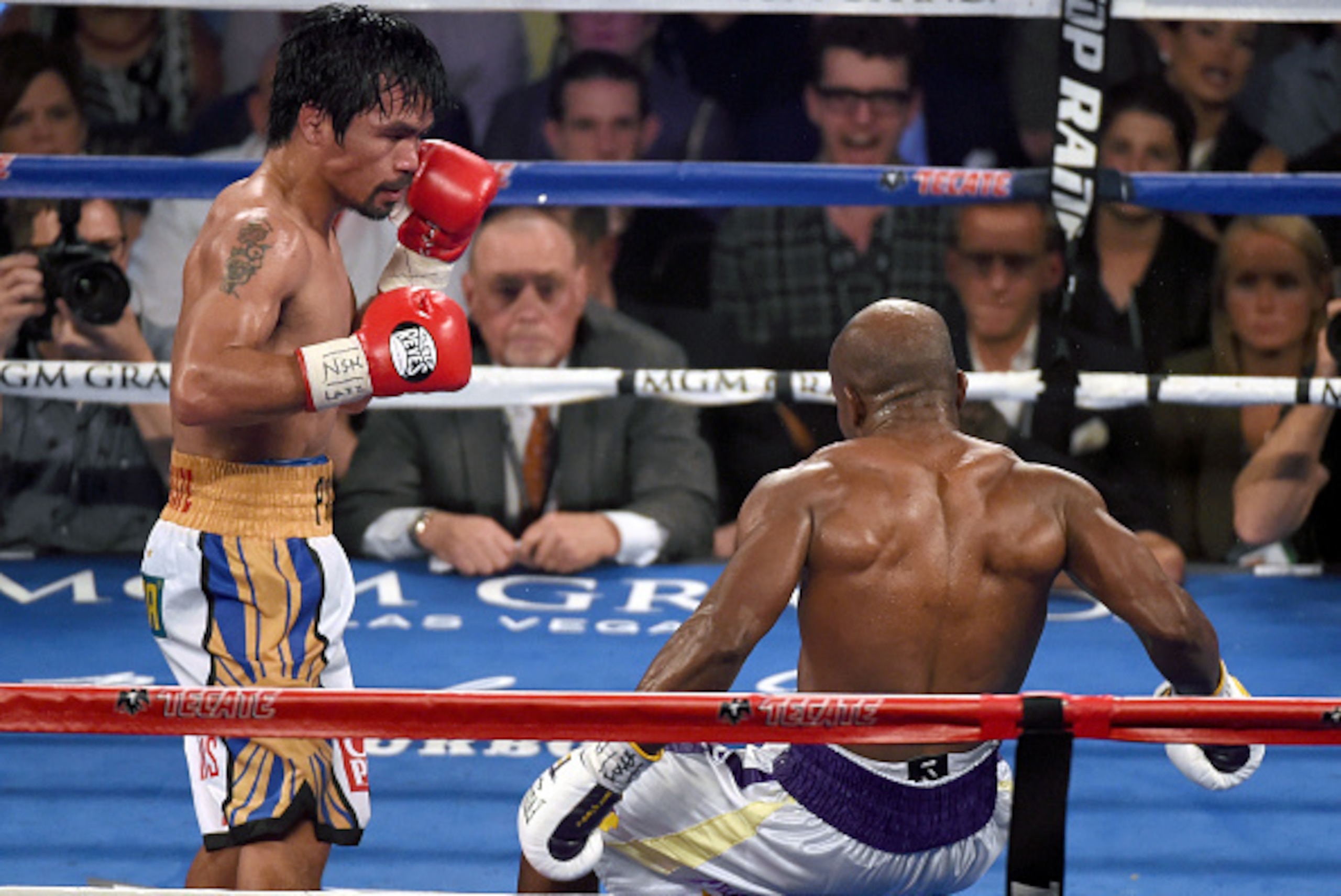 LAS VEGAS, NEVADA - APRIL 09: Manny Pacquiao (L) knocks down Timothy Bradley Jr. in the ninth round of their welterweight fight at MGM Grand Garden Arena on April 9, 2016 in Las Vegas, Nevada. Pacquiao won by unanimous decision. (Photo by Ethan Miller/G LAS VEGAS, NEVADA - APRIL 09: Manny Pacquiao (L) knocks down Timothy Bradley Jr. in the ninth round of their welterweight fight at MGM Grand Garden Arena on April 9, 2016 in Las Vegas, Nevada. Pacquiao won by unanimous decision. (Photo by Ethan Miller/G