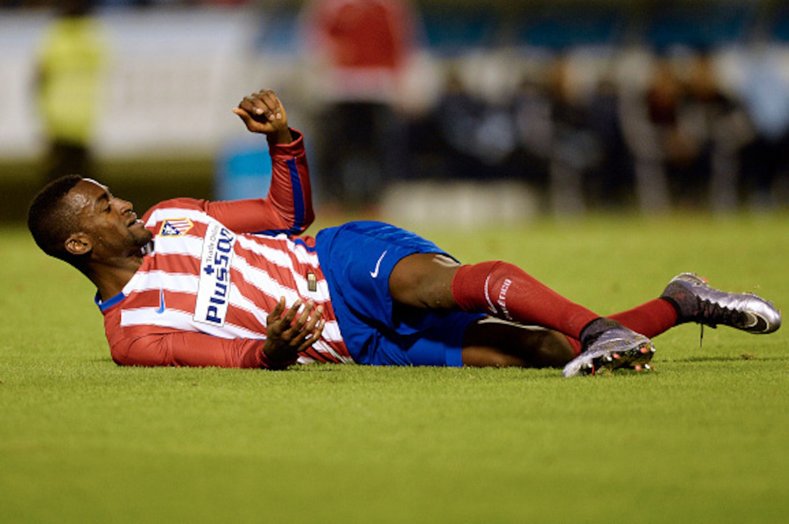 Atletico Madrid's Colombian forward Jackson Martinez lies on the ground during the Spanish Copa del Rey (King's Cup) football match Celta Vigo vs Club Atletico de Madrid at the Balaidos stadium in Vigo on January 20, 2016.  The match ended with a 0-0 draw