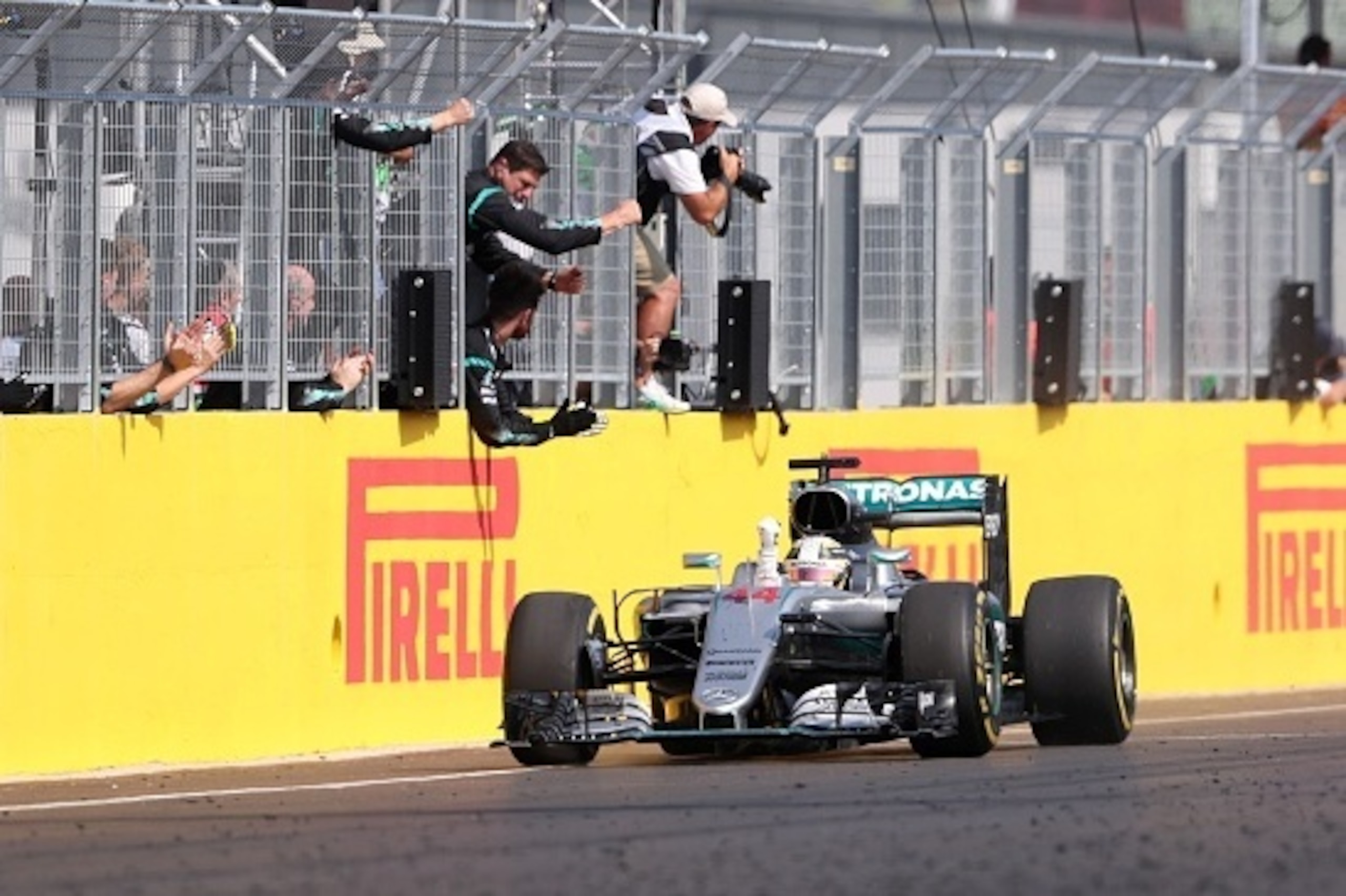 Mercedes AMG Petronas F1 Team's British driver Lewis Hamilton celebrates winning the Hungarian Formula One Grand Prix on July 24, 2016 at the Hungaroring circuit near Budapest.     / AFP / FERENC ISZA        (Photo credit should read FERENC ISZA/AFP/Getty