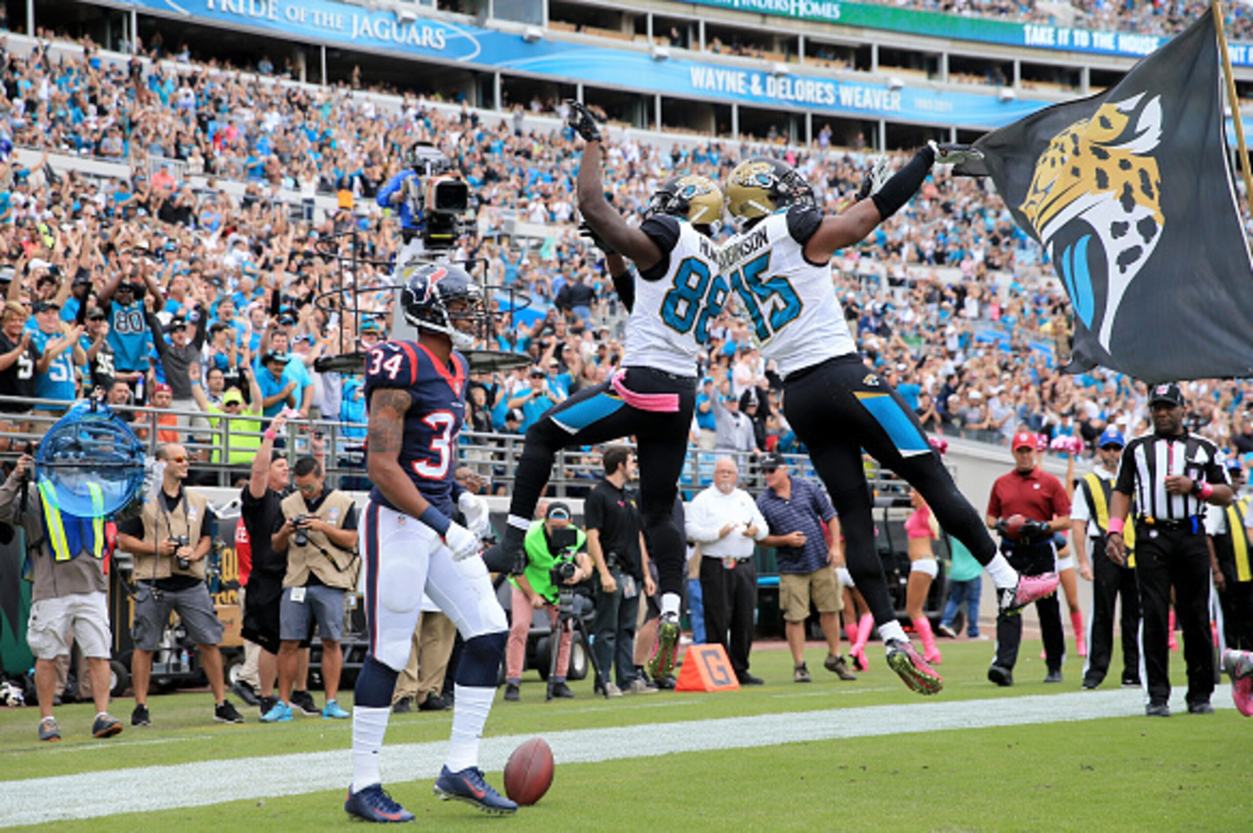 JACKSONVILLE, FL - OCTOBER 18:    Allen Robinson #15 of the Jacksonville Jaguars celebrates with  Allen Hurns #88 following a touchdown against the Houston Texans at EverBank Field on October 18, 2015 in Jacksonville, Florida.  (Photo by Sam Greenwood/Get
