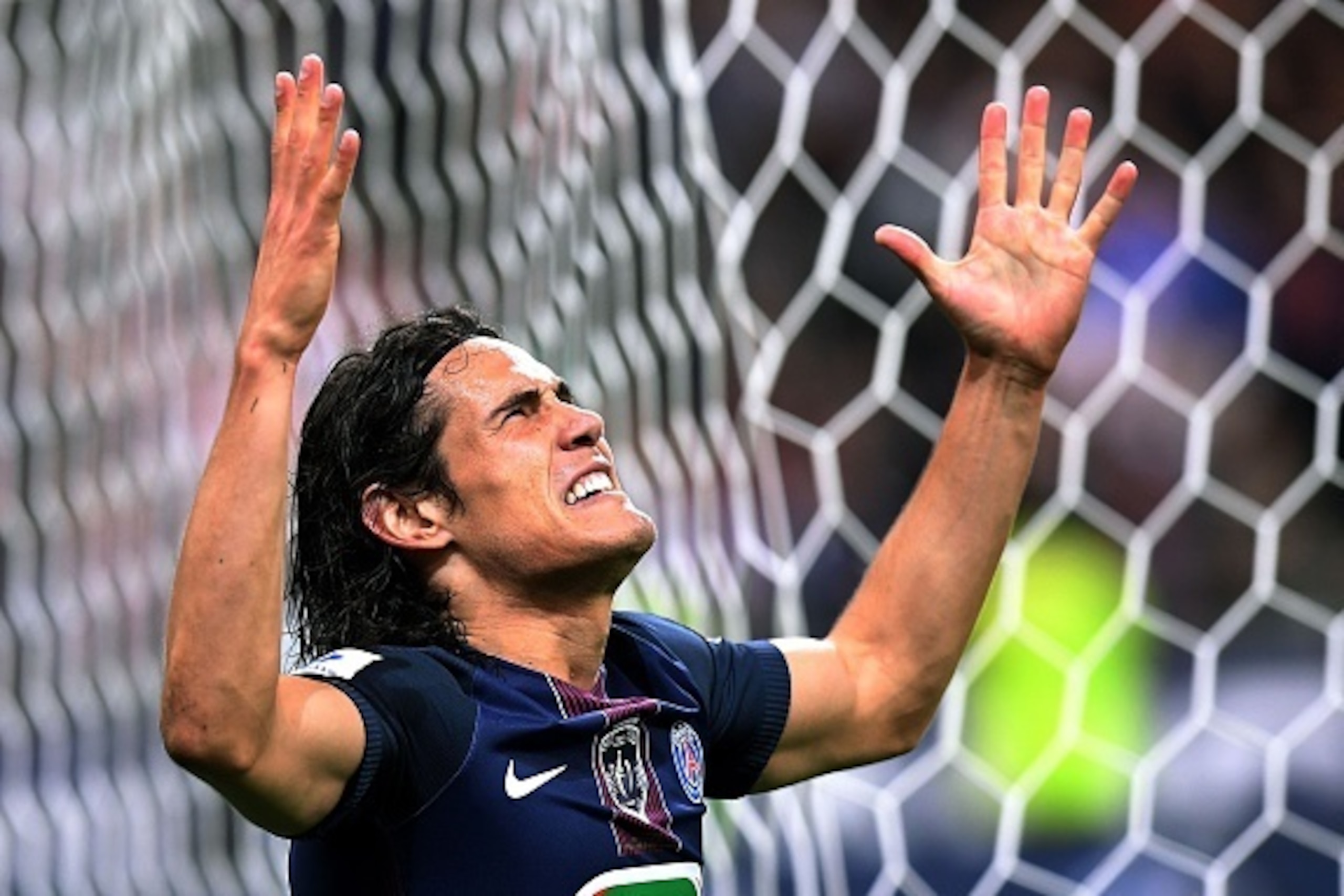 TOPSHOT - Paris Saint-Germain's Uruguayan forward Edinson Cavani celebrates after scoring a goal during the French Cup final football match beween Marseille (OM) and Paris Saint-Germain (PSG) on May 21, 2016 at the Stade de France in Saint-Denis, north of TOPSHOT - Paris Saint-Germain's Uruguayan forward Edinson Cavani celebrates after scoring a goal during the French Cup final football match beween Marseille (OM) and Paris Saint-Germain (PSG) on May 21, 2016 at the Stade de France in Saint-Denis, north of