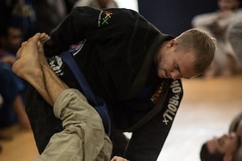 TO GO WITH AFP STORY by Sebastian Smith New Zealander Jason Lee (top) practices jiu-jitsu in Rio de Janeiro, Brazil, on September 14, 2015. Once restricted almost entirely to the Latin American country, Brazilian jiu-jitsu is one of the world's fastest-gr