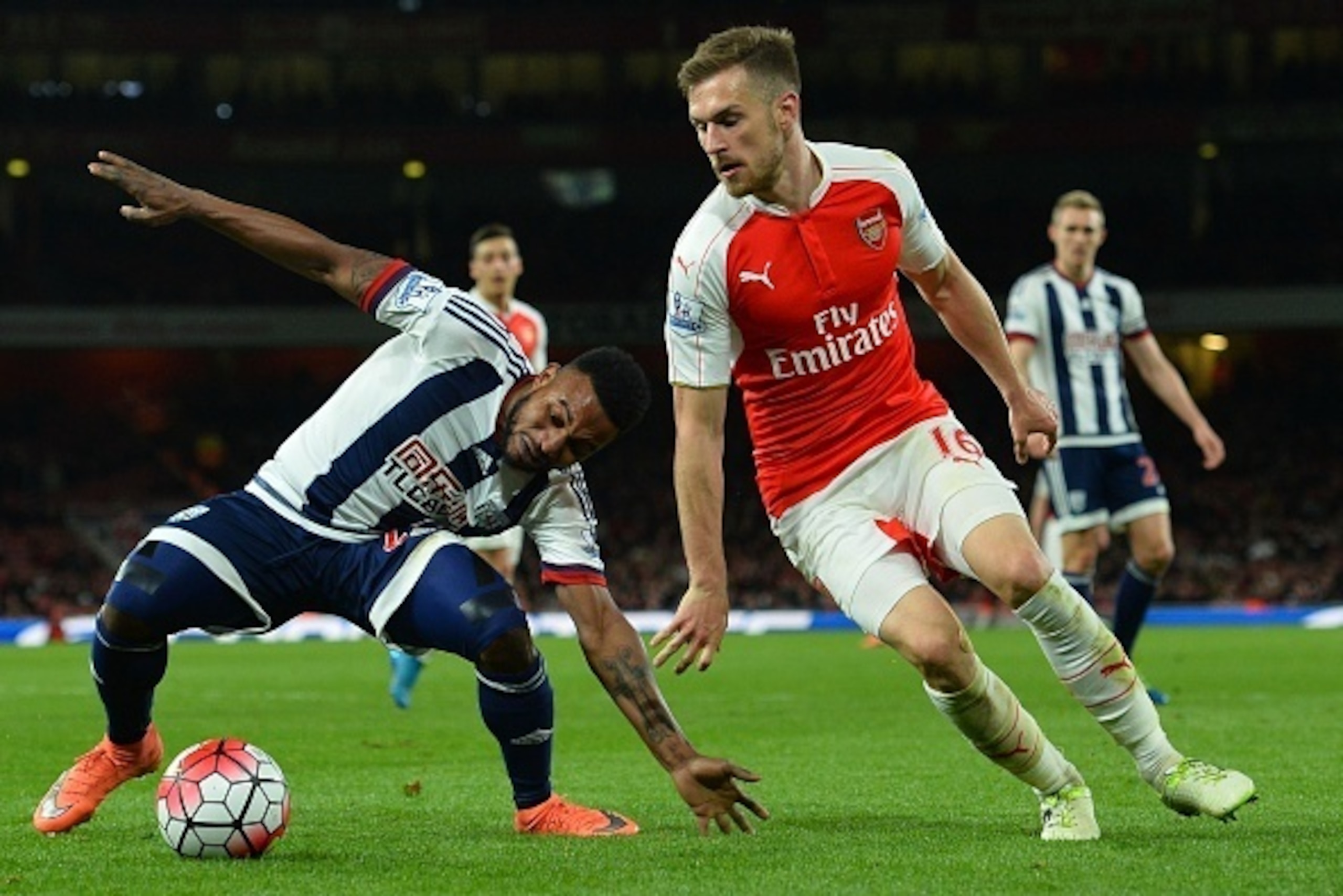 Arsenal's Welsh midfielder Aaron Ramsey (R) takes on West Bromwich Albion's Beninese midfielder Stephane Sessegnon (L) during the English Premier League football match between Arsenal and West Bromwich Albion at the Emirates Stadium in London on April 21, Arsenal's Welsh midfielder Aaron Ramsey (R) takes on West Bromwich Albion's Beninese midfielder Stephane Sessegnon (L) during the English Premier League football match between Arsenal and West Bromwich Albion at the Emirates Stadium in London on April 21,