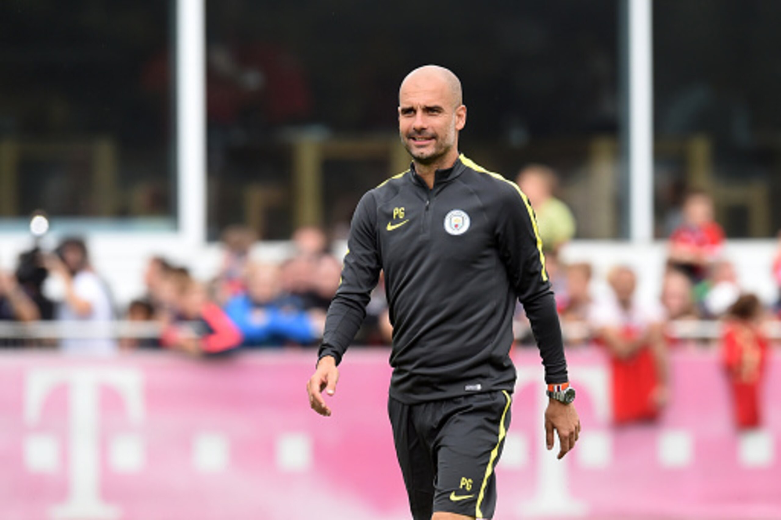 Manchester's new Spanish headcoach Pep Guardiola arrives for a training session of Manchester City at the training ground of the German first division football team FC Bayern Munich in Munich, southern Germany, on July 21, 2016.  / AFP / CHRISTOF STACHE  