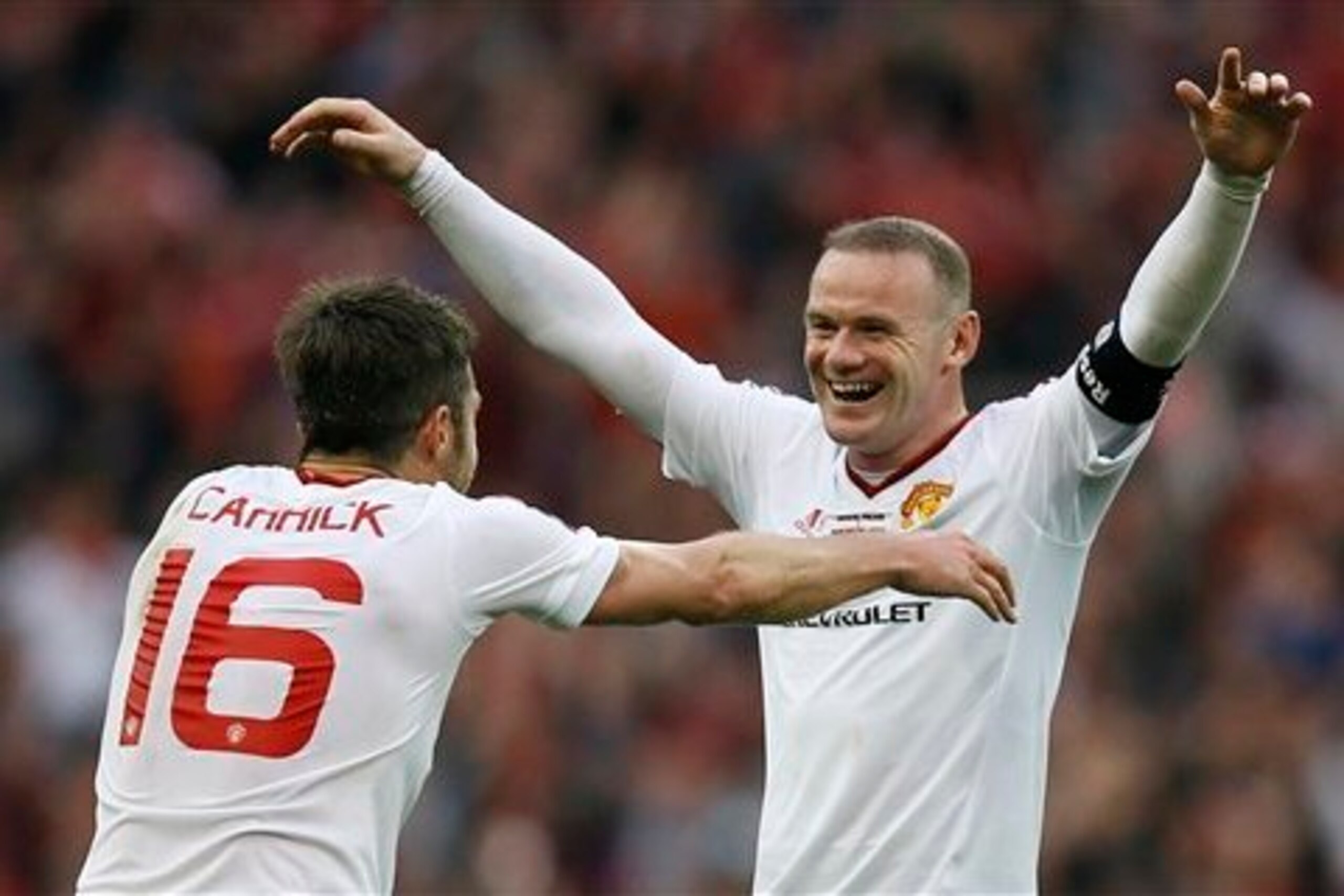 Michael Carrick and Wayne Rooney celebrate finally winning the FA Cup.