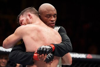 British fighter Michael Bisping embraces Anderson Silva of Brazil (R) after their middleweight bout at the Ultimate Fighting Championship (UFC) Fight Night event in London on February 27, 2016.
Bisping beat Silva on a judge's decision over five rounds. / 