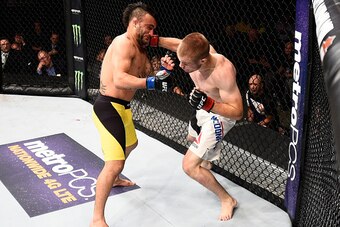 SIOUX FALLS, SD - JULY 13:   (R-L) Michael McDonald punches John Lineker in their bantamweight bout during the UFC Fight Night event on July 13, 2016 at Denny Sanford Premier Center in Sioux Falls, South Dakota. (Photo by Jeff Bottari/Zuffa LLC/Zuffa LLC 