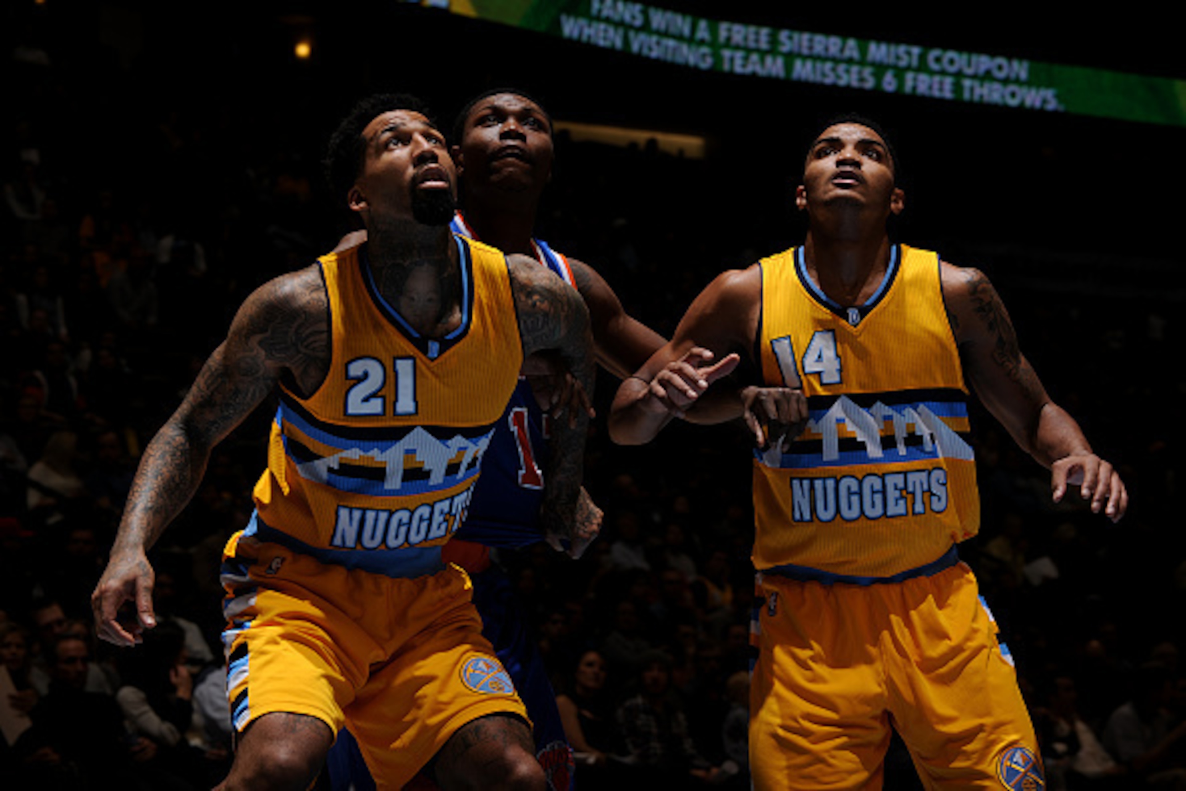 DENVER, CO - March 9: Wilson Chandler #21 and Gary Harris #14 of the Denver Nuggets box out against Cleanthony Early #17 of the New York Knicks on March 9, 2015 at the Pepsi Center in Denver, Colorado. NOTE TO USER: User expressly acknowledges and agrees 